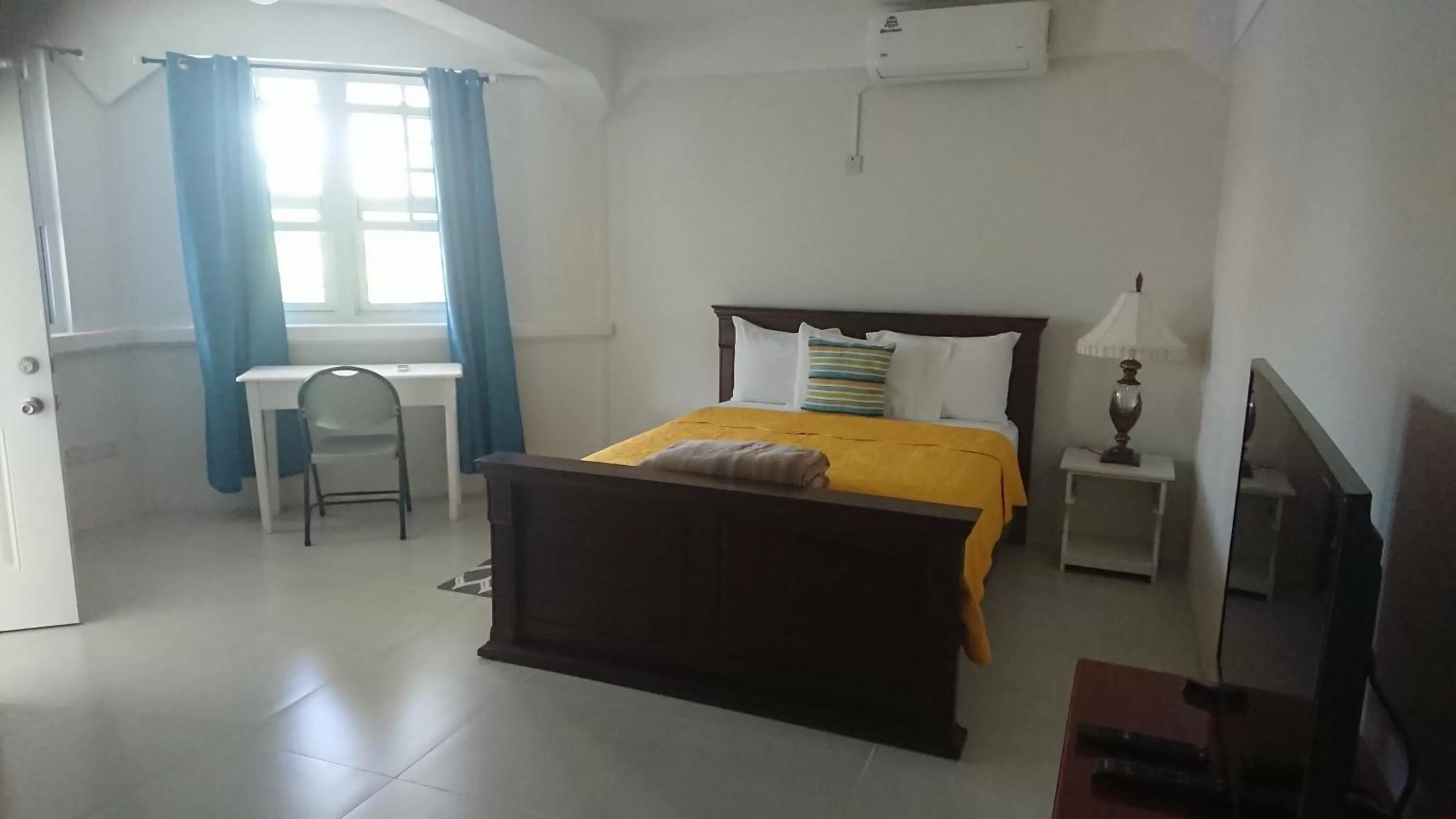 Bed in Classique International in Dominica