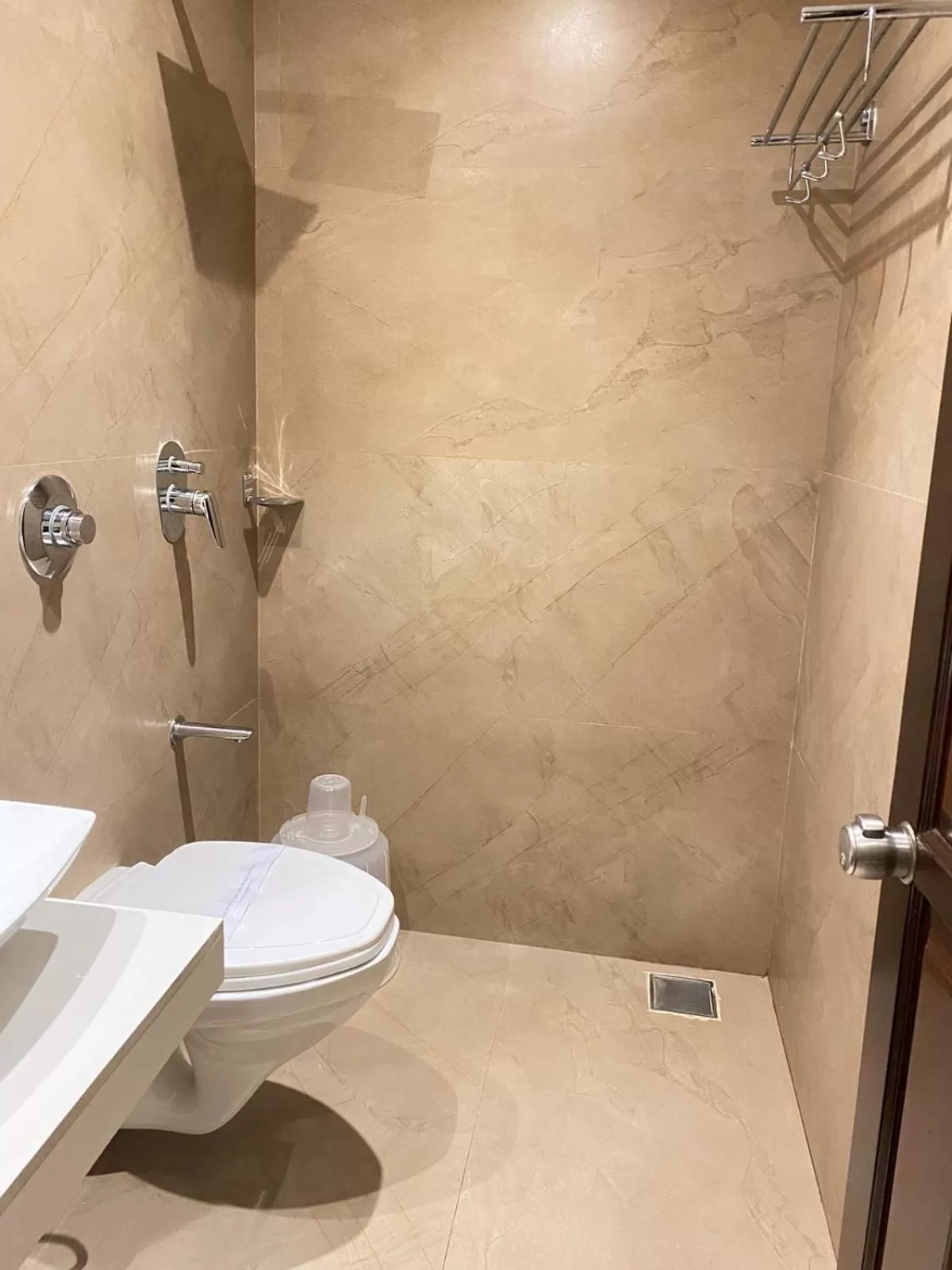 Shower in Hotel Plaza Heights by RAK Rooms, Mangaluru