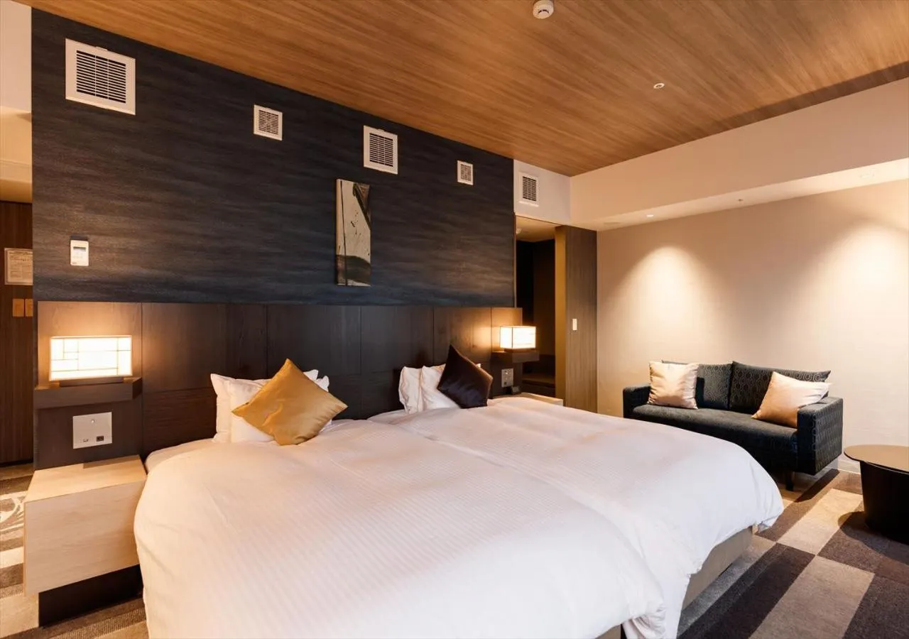 Bed in Kanazawa New Grand Hotel Prestige