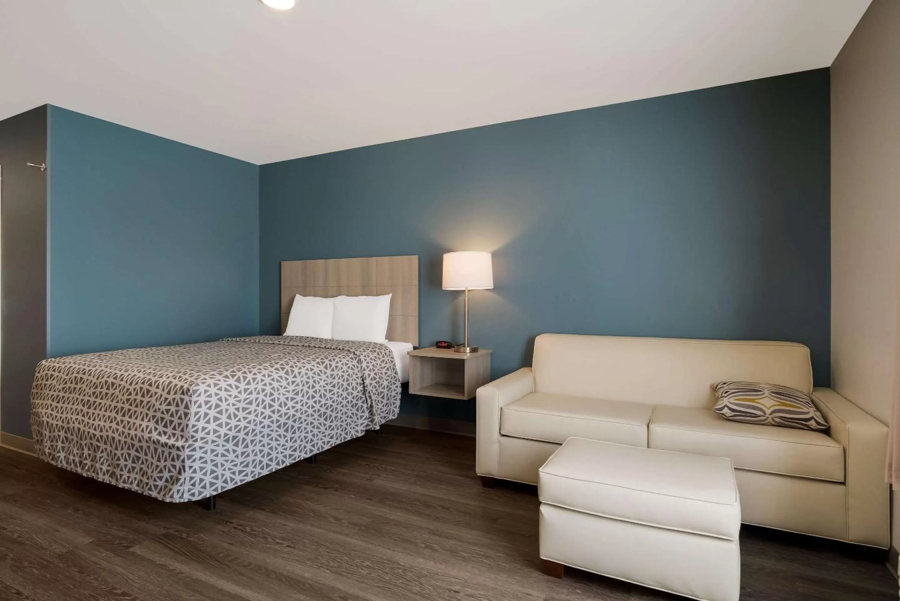 Bedroom, Bed in WoodSpring Suites Grand Rapids Kentwood