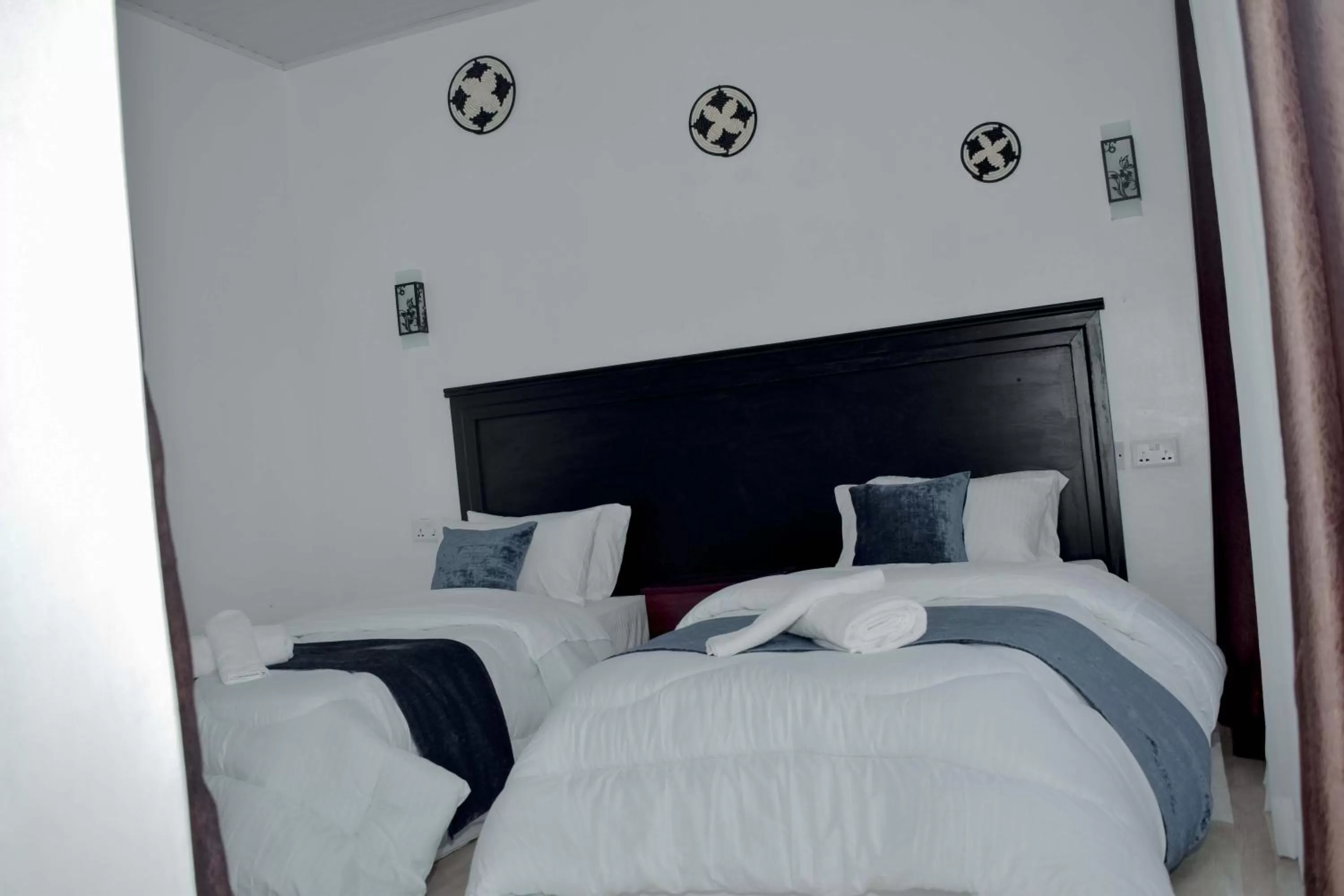 Bed in INZOZI AFRICA HOUSE B&B-Gishushu