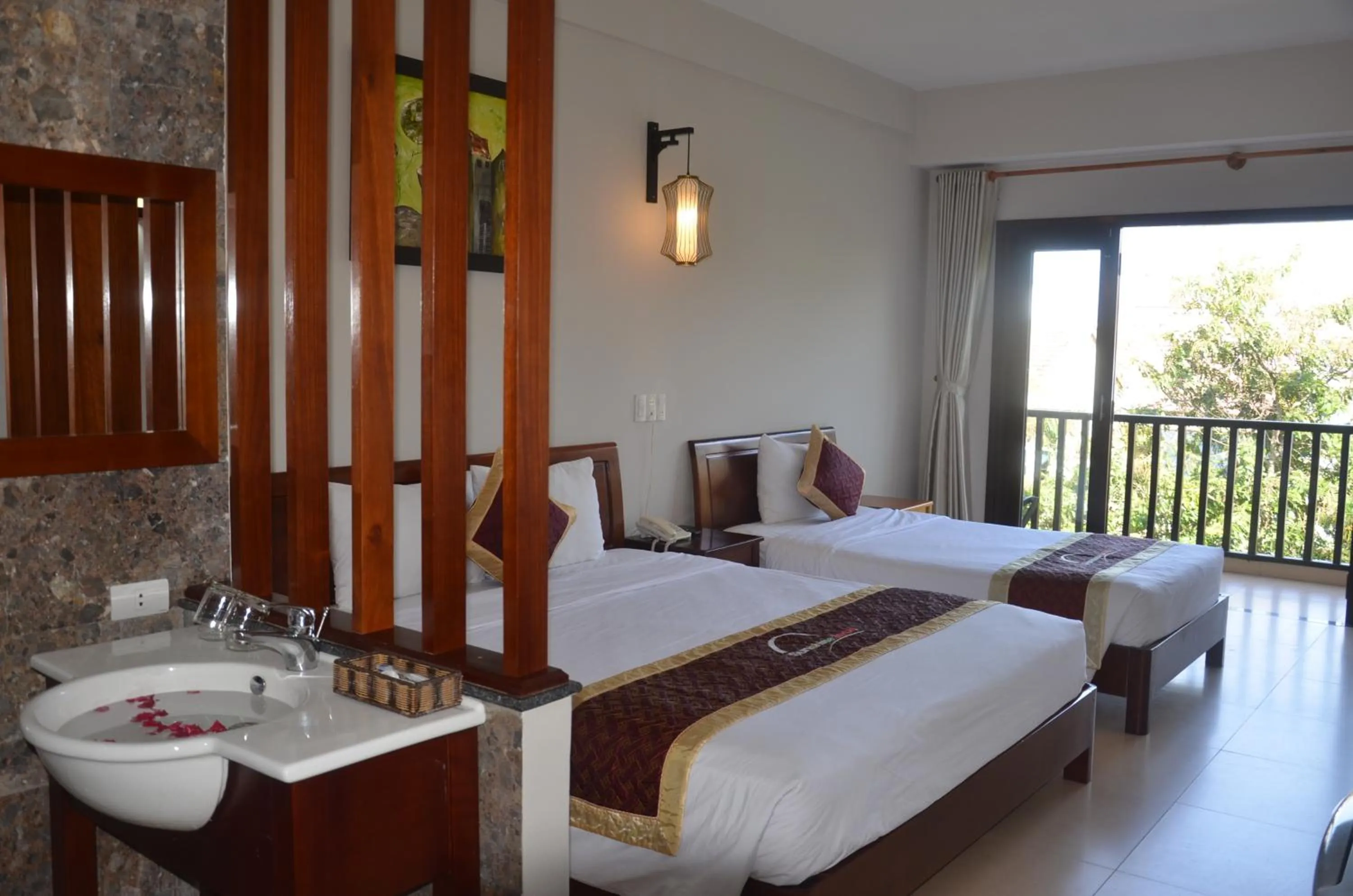 Bed in Sunshine Hoian Hotel