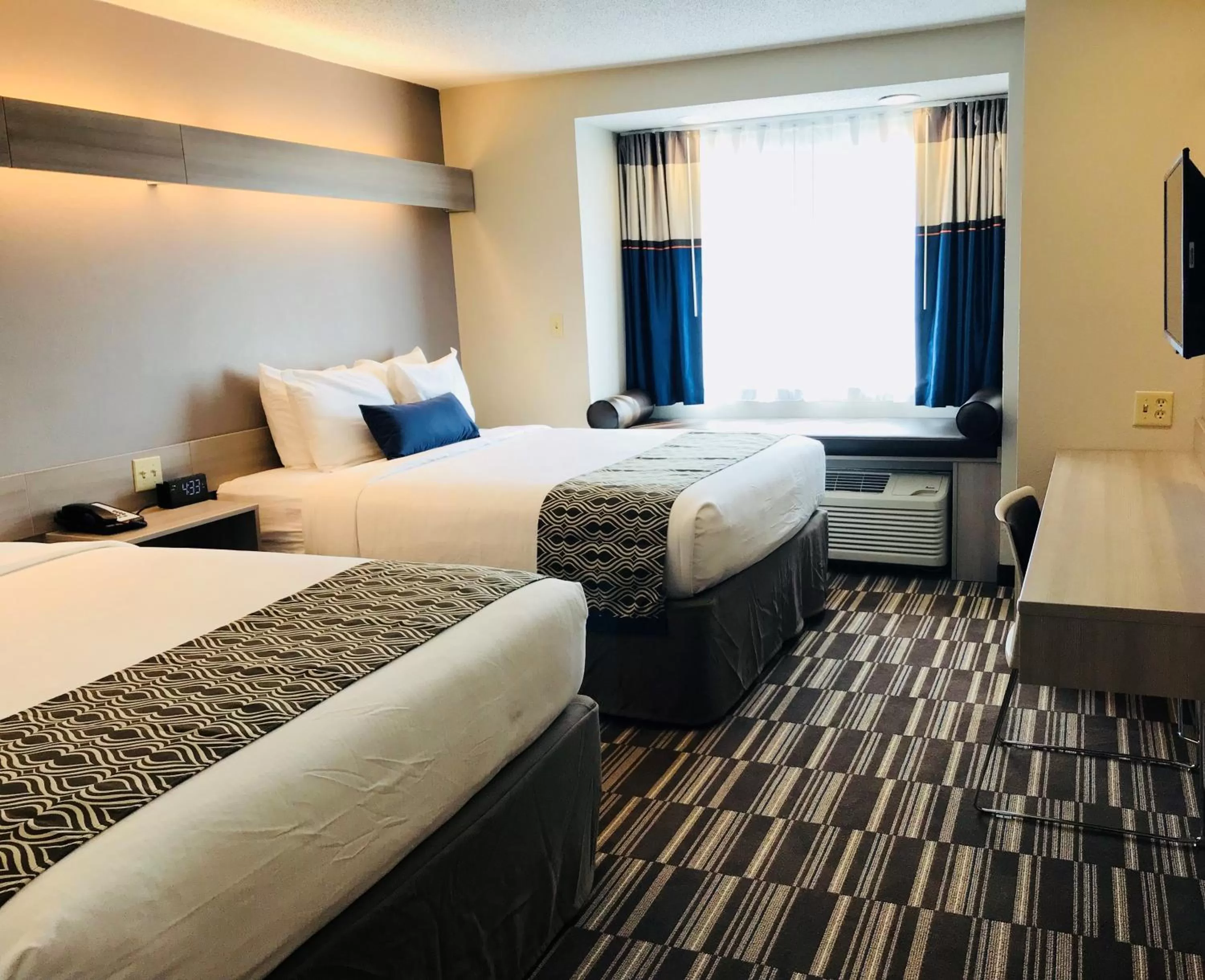 Bed in Microtel Inn & Suites by Wyndham Atlanta Buckhead Area