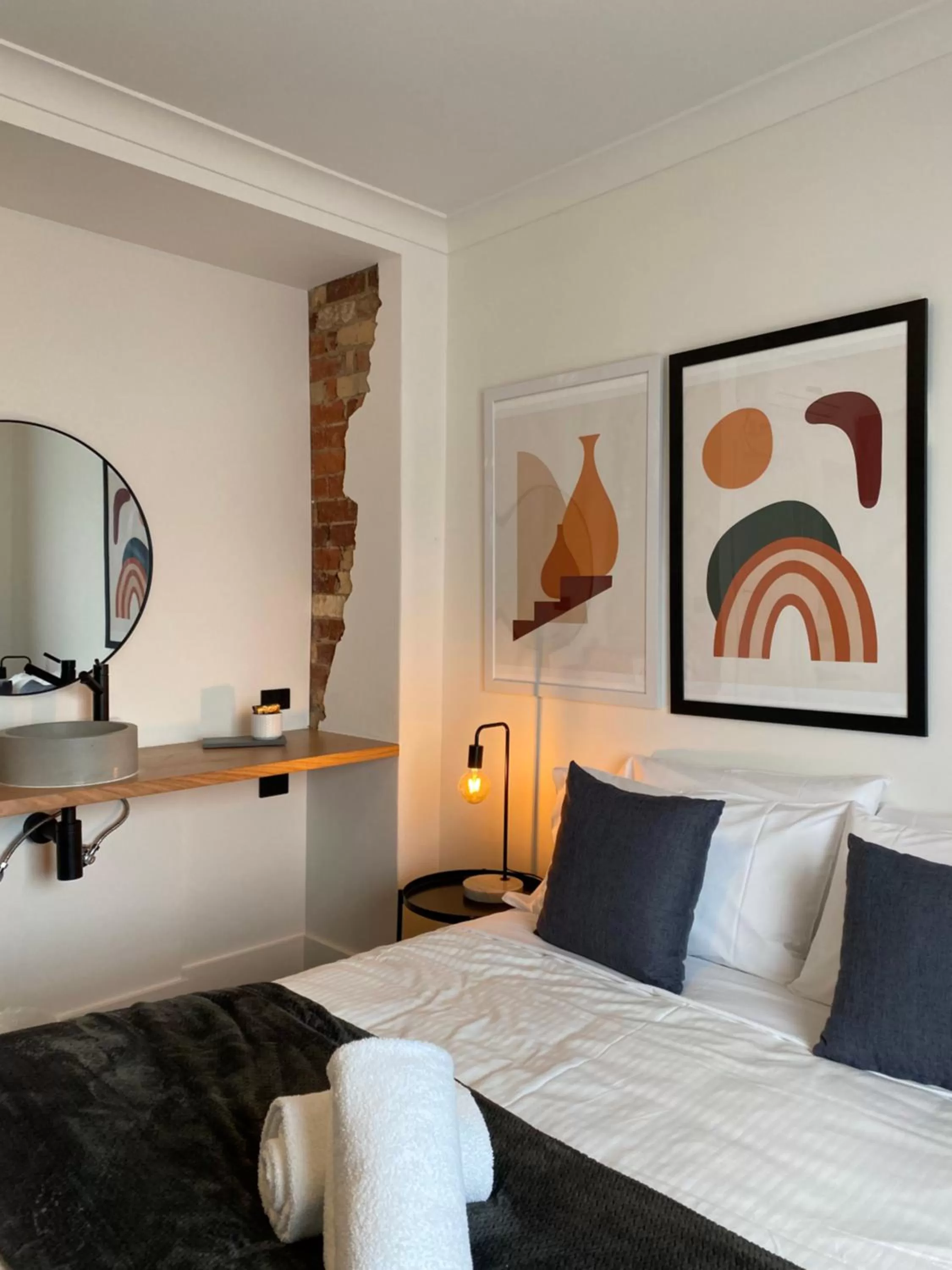 Bed in The Astor Hotel Motel