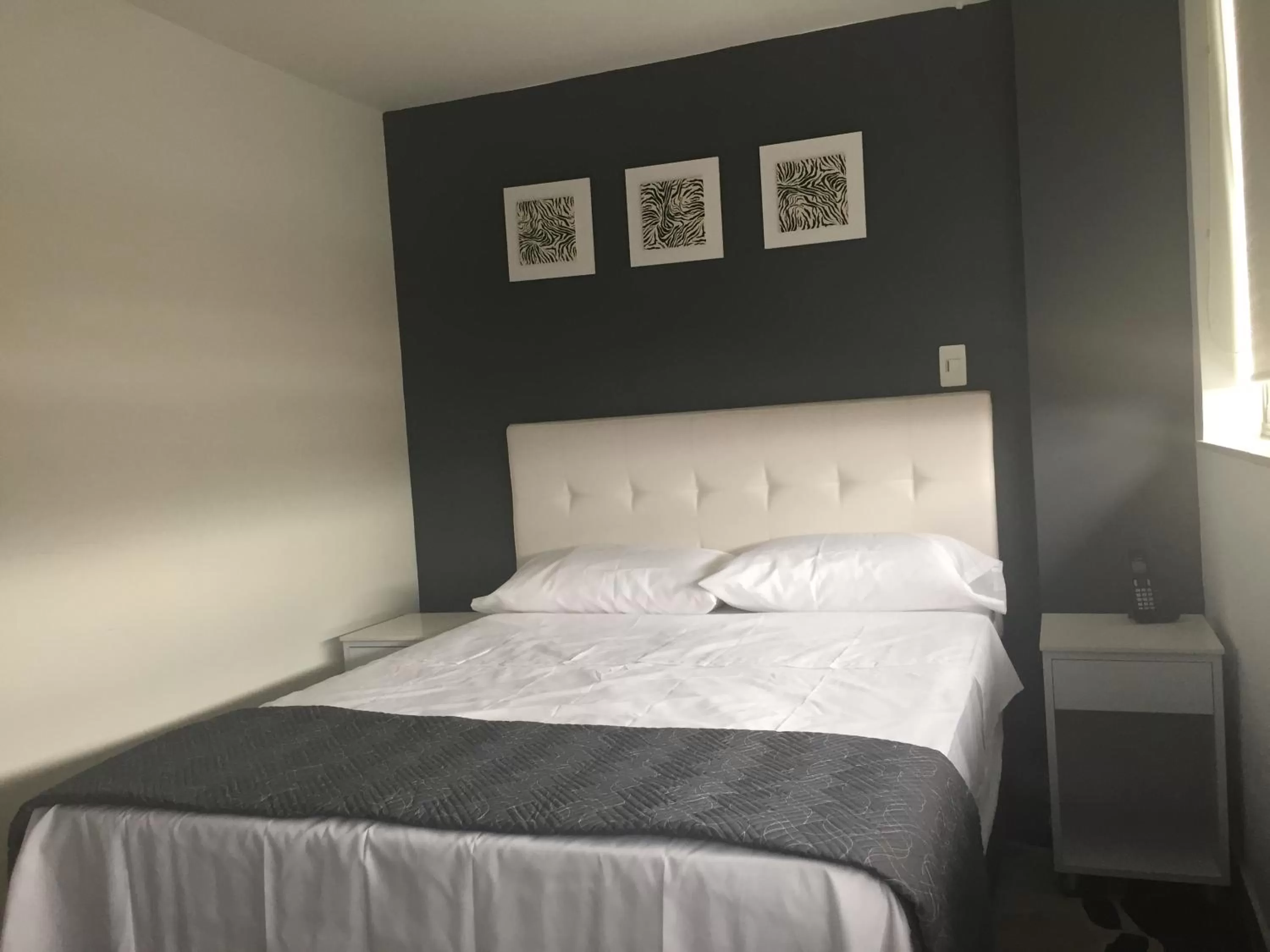 Bed in Hotel Garden City Boutique