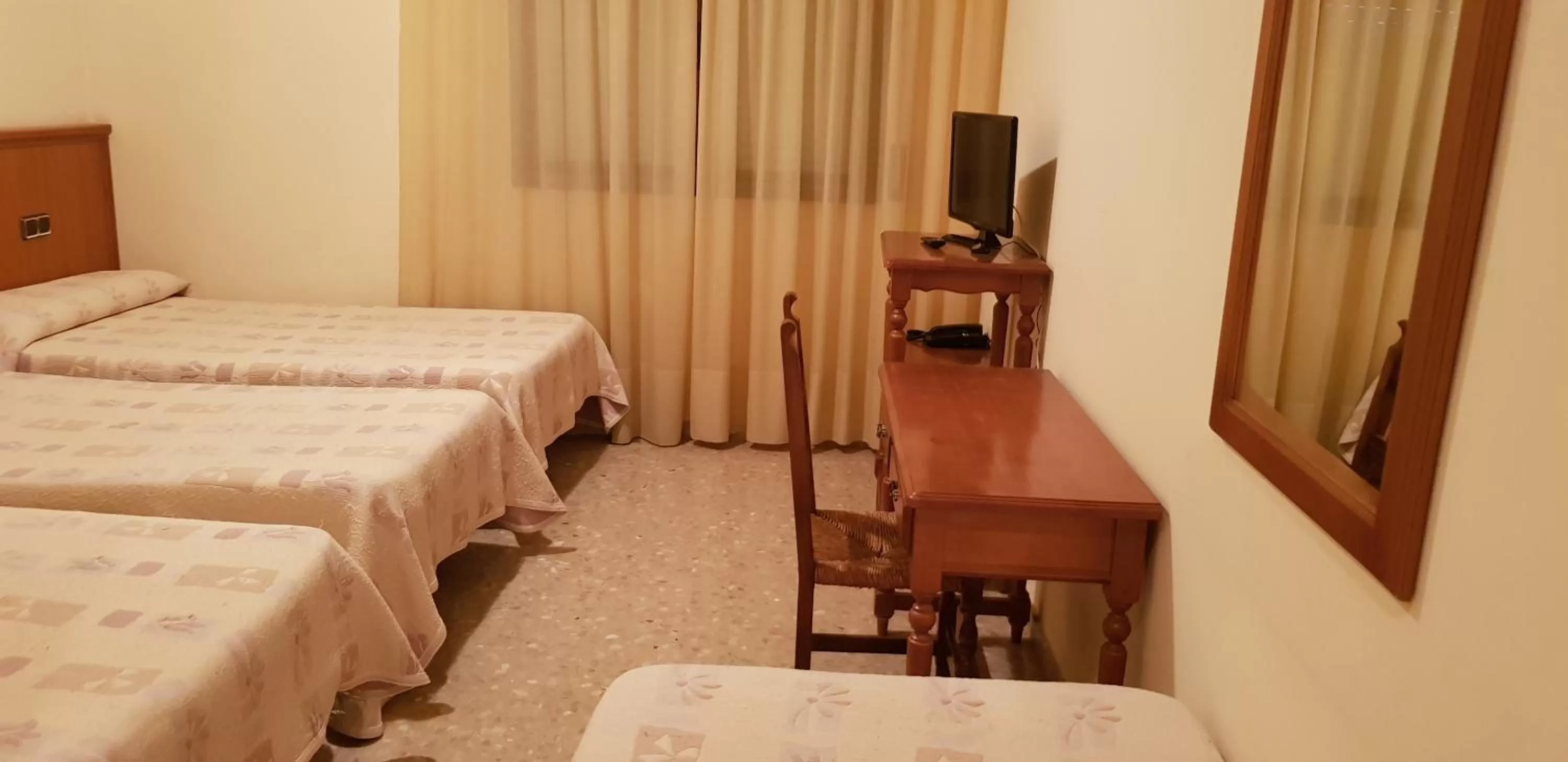 Bed in Hotel Reina Isabel