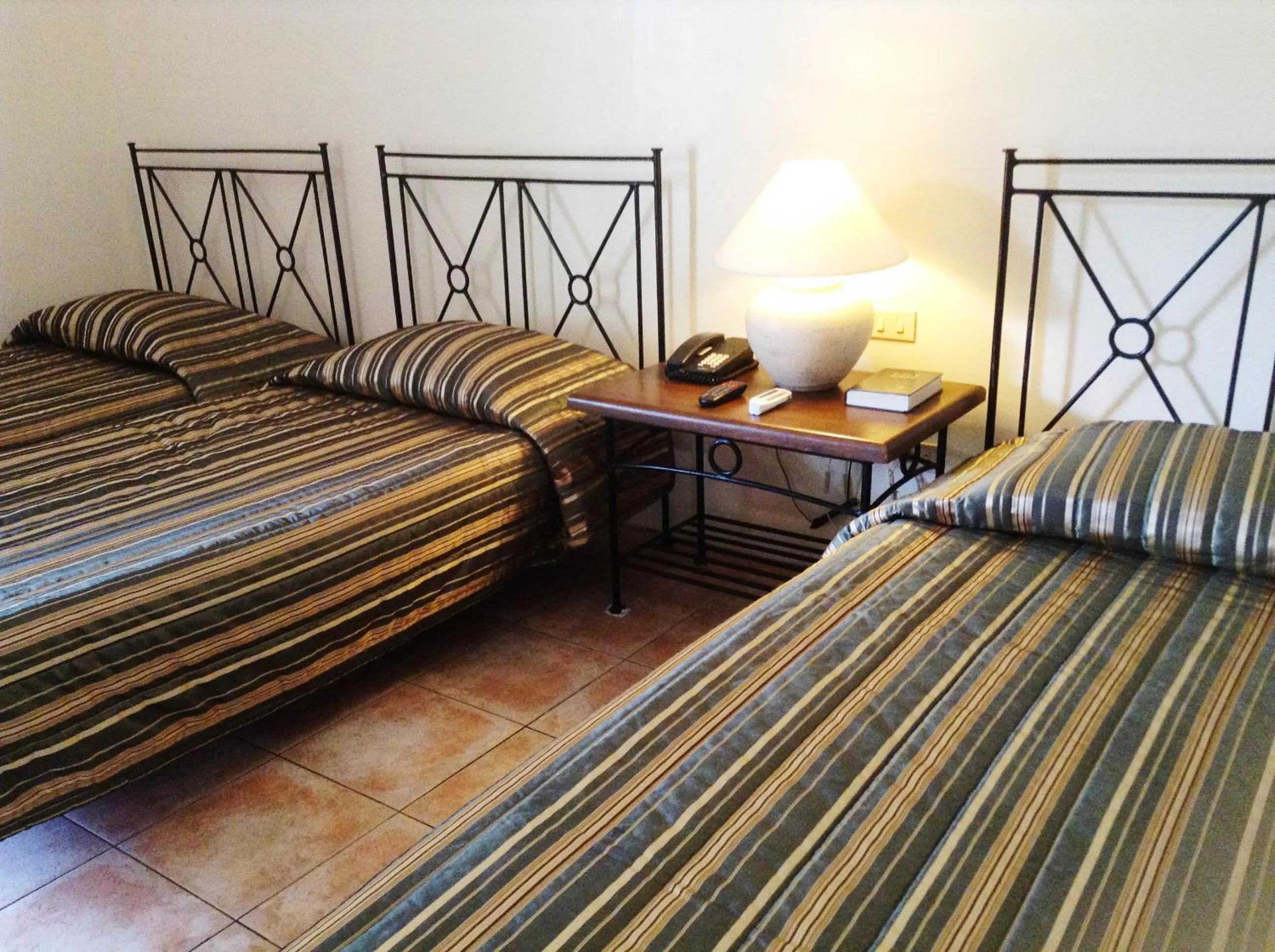 Bed in Citystate Asturias Hotel Palawan
