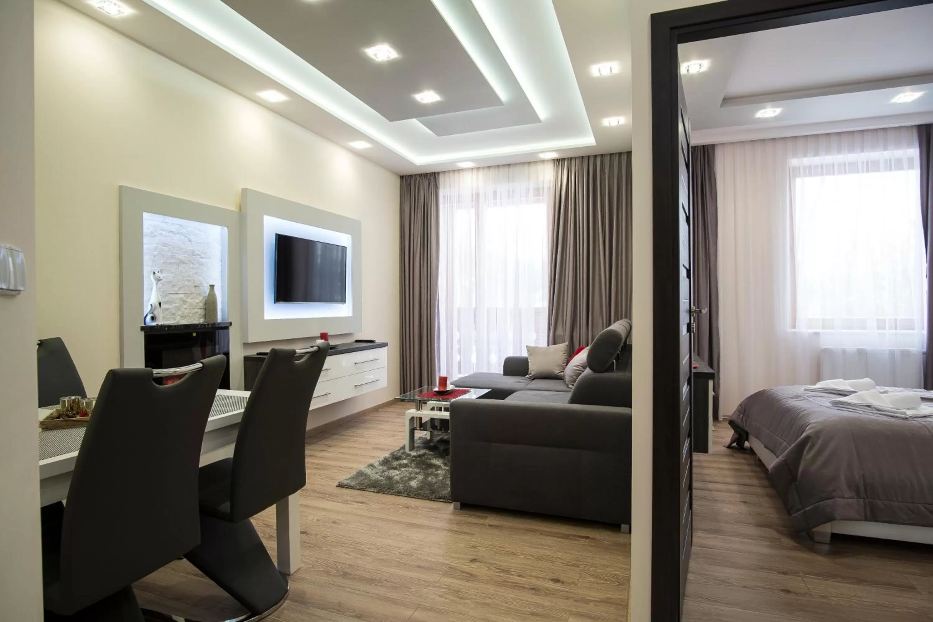 Communal lounge/ TV room, Bed in Aparthotel Giewont