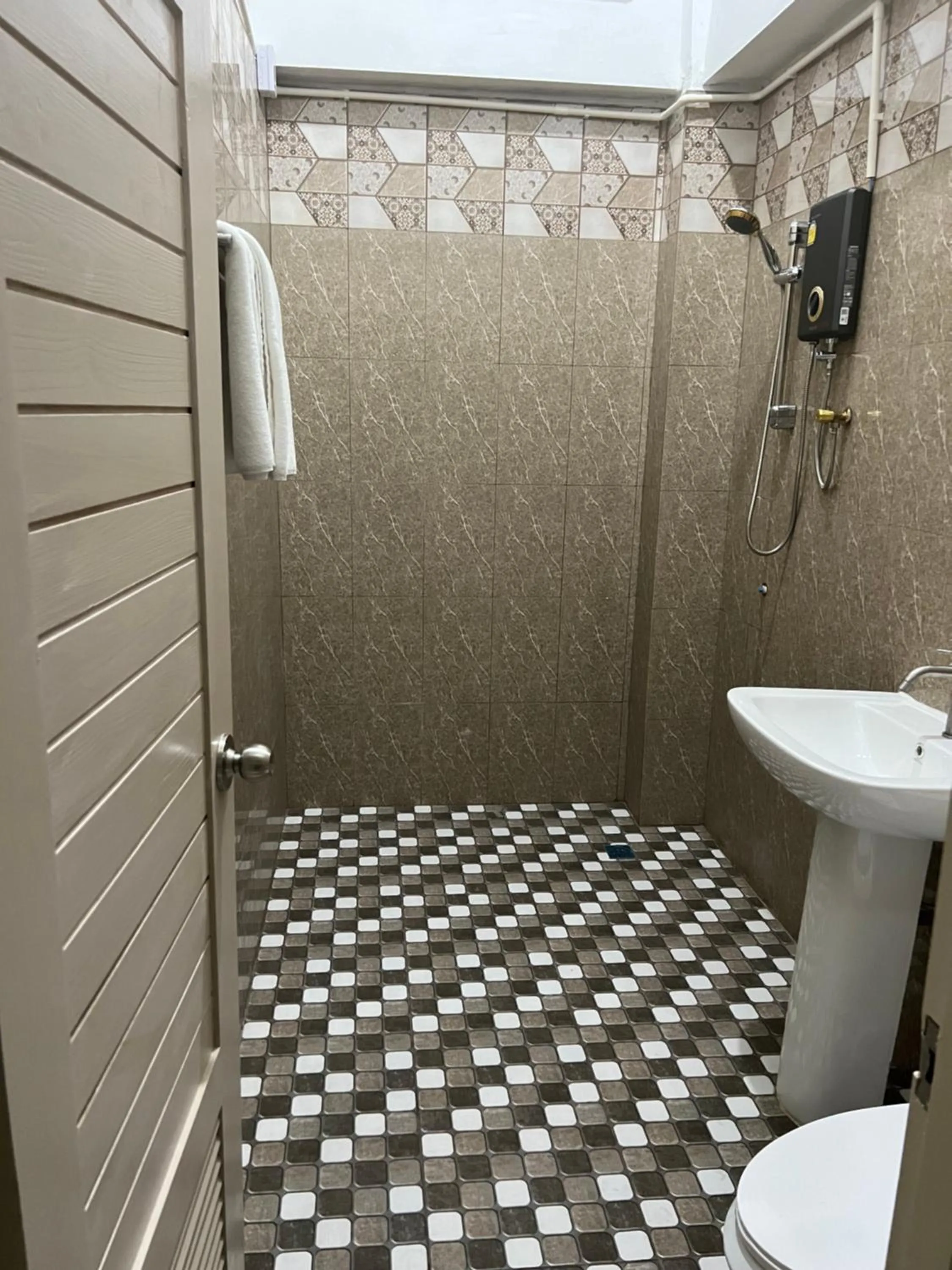 Shower in Mall Suites Hotel