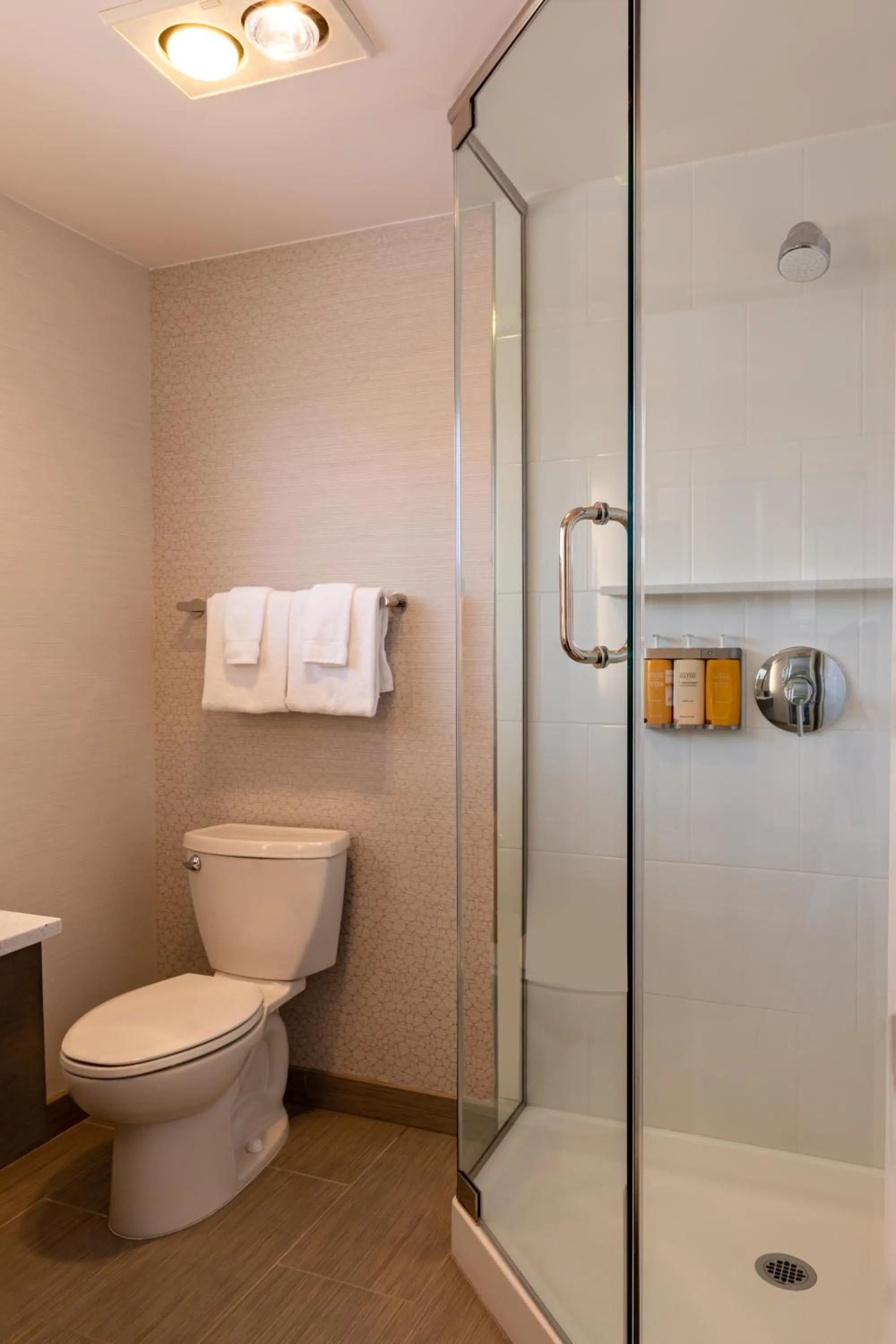 Shower in West Beach Inn, a Coast Hotel