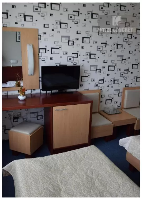 TV and multimedia, TV/Entertainment Center in Hotel Concrete