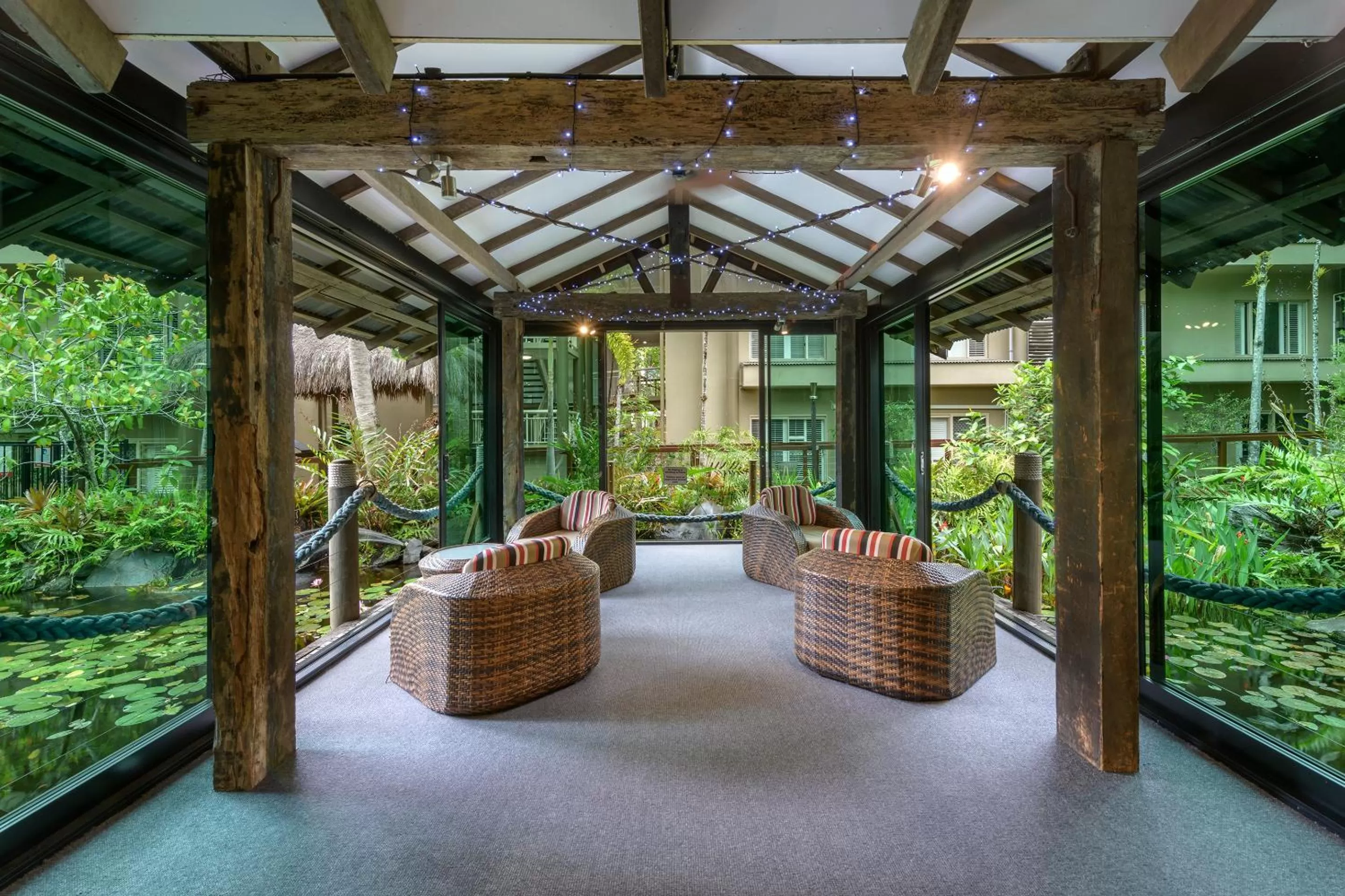 Communal lounge/ TV room in Ramada Resort by Wyndham Port Douglas