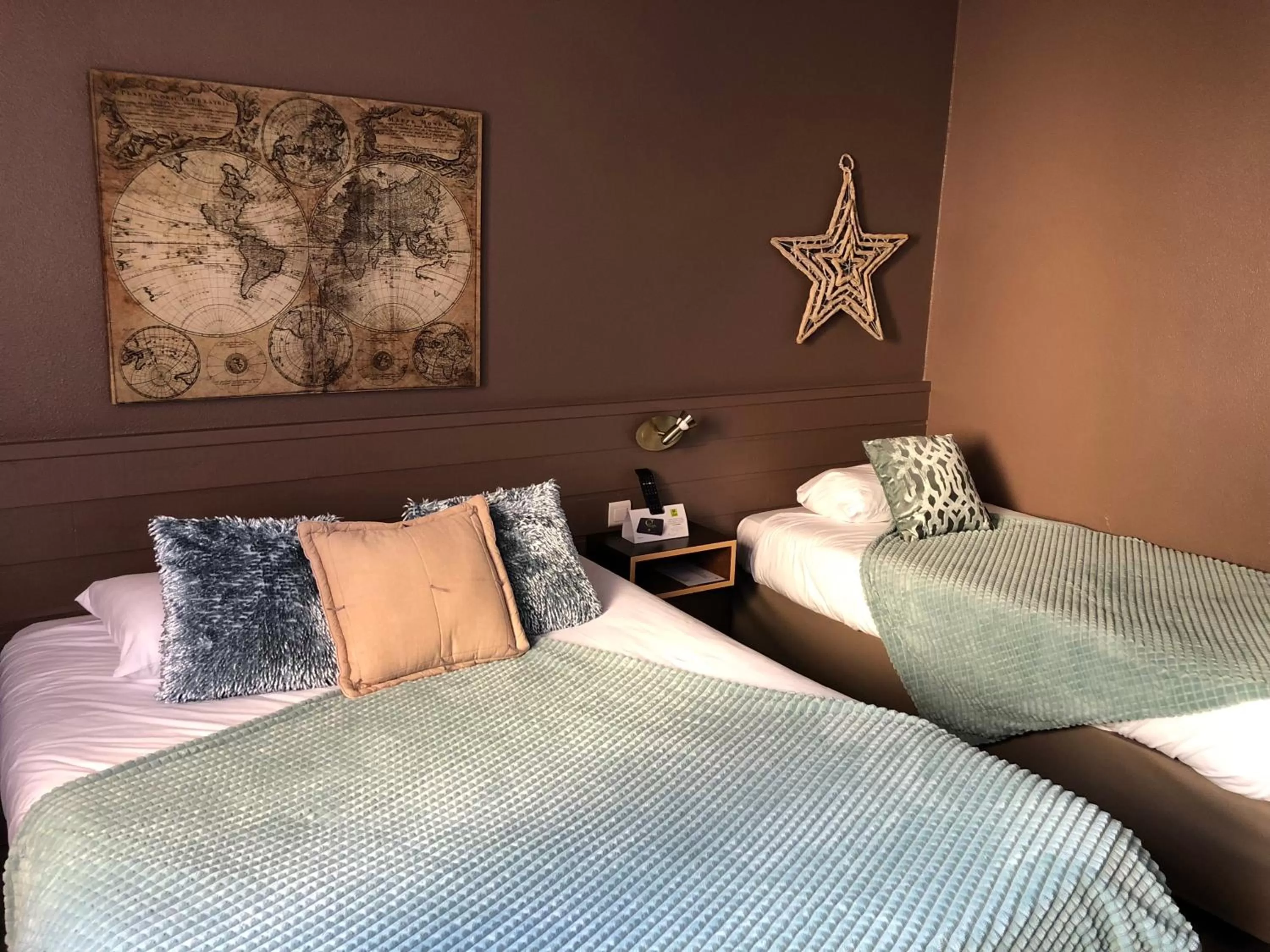 Bed in Logis Hôtel Burnichon