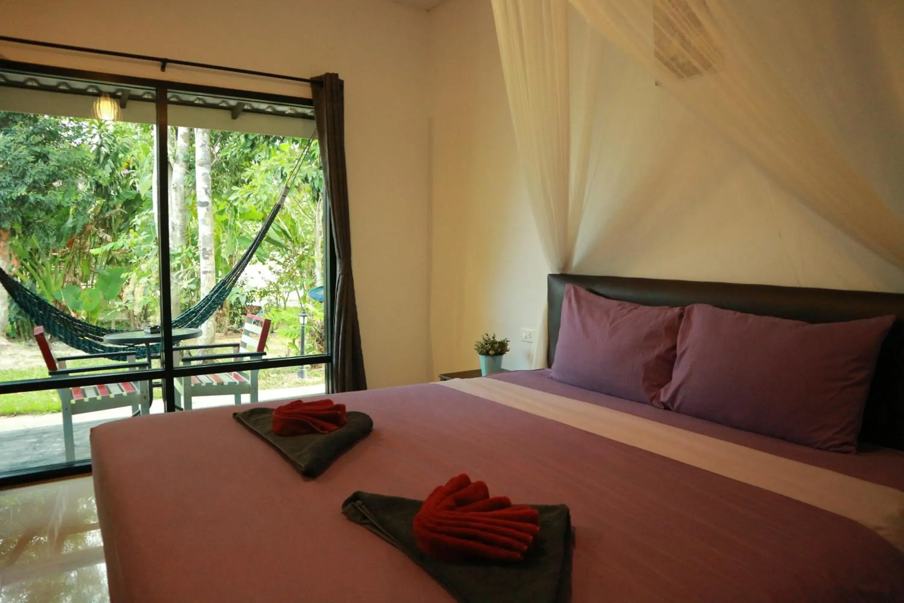 Double Room with Garden View in Raven Blue Double Room with Garden View in Raven Blue