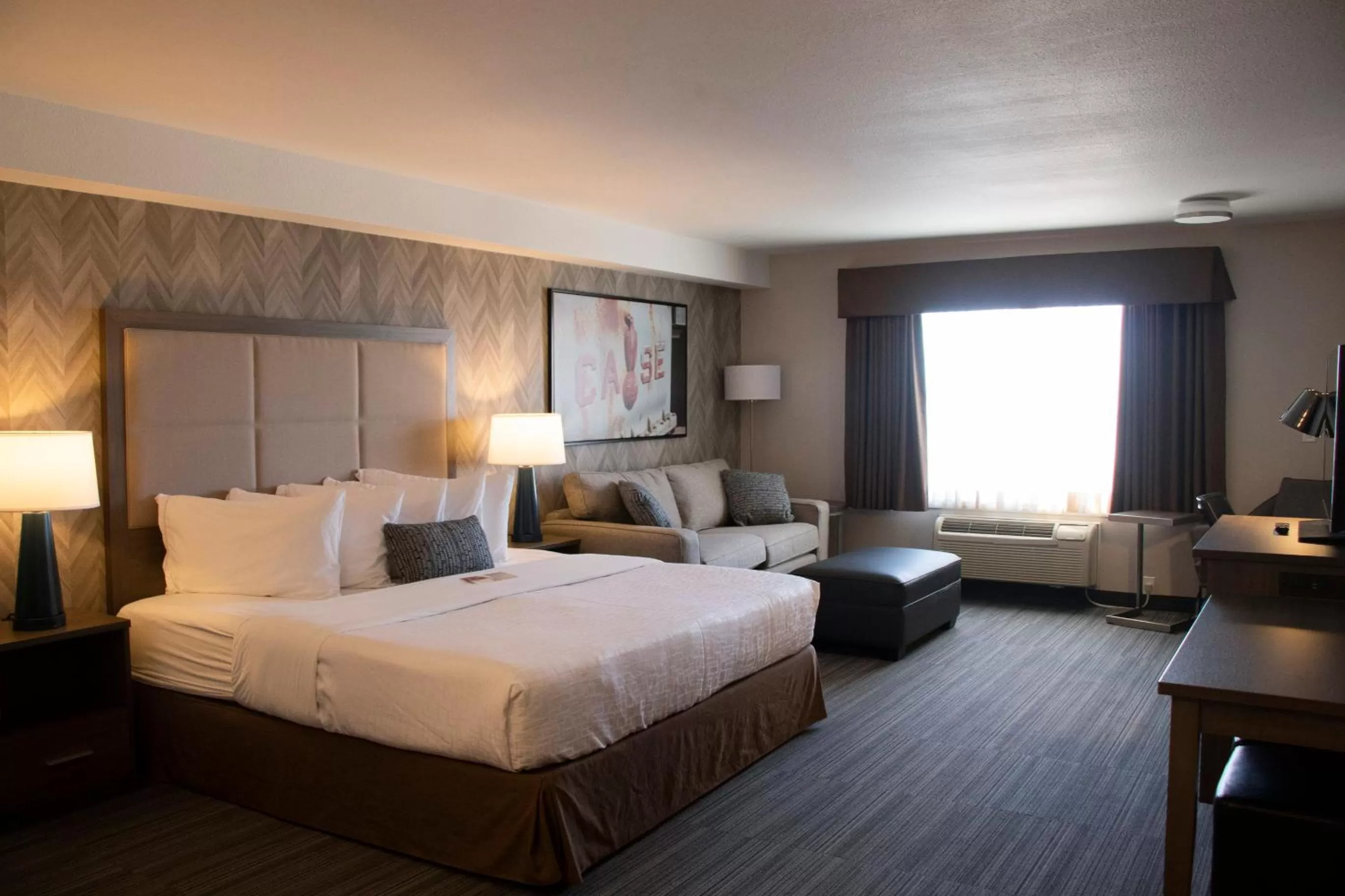 Photo of the whole room, Bed in Ramada by Wyndham Airdrie Hotel & Suites