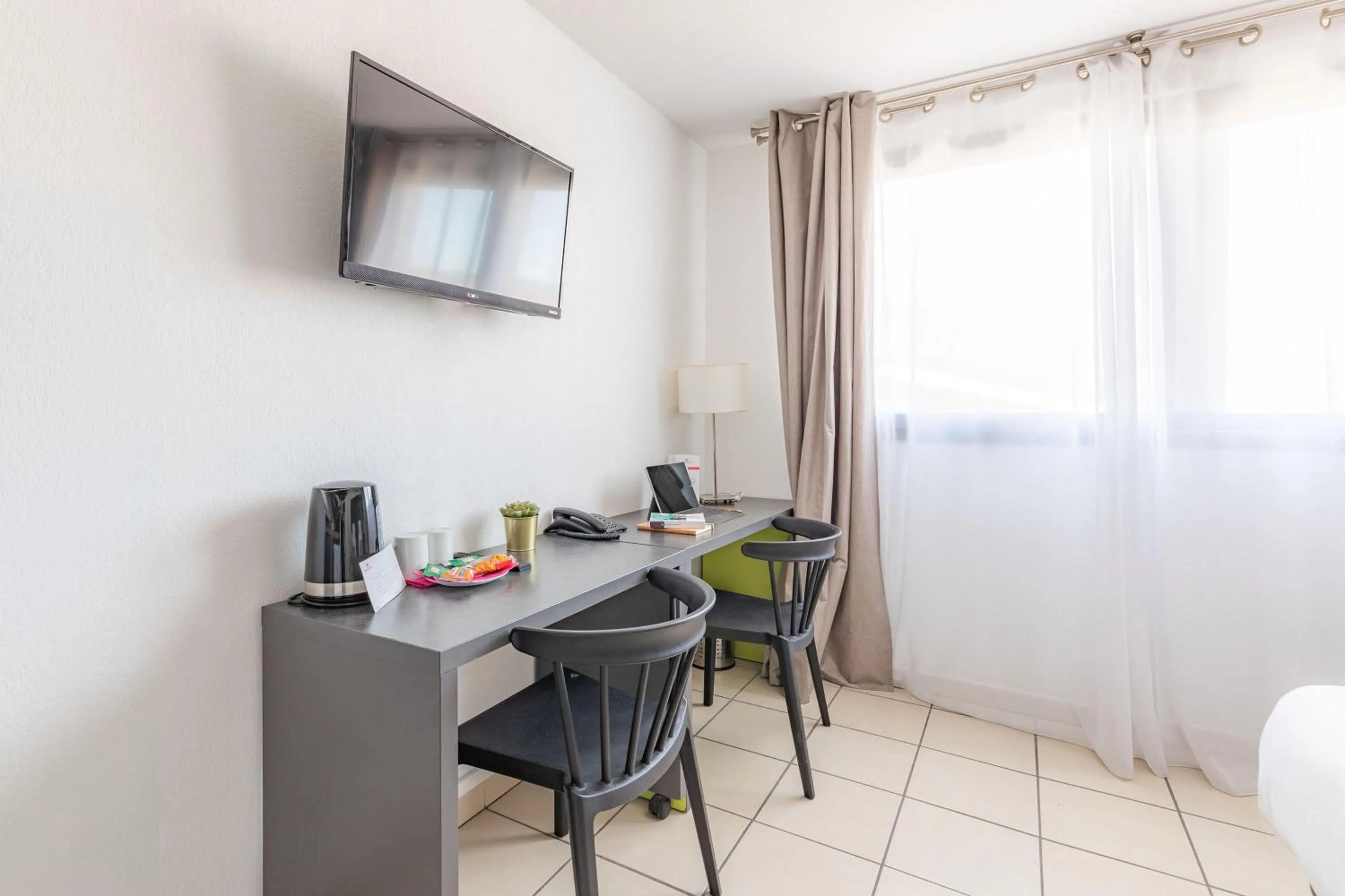 TV and multimedia in Appart'City Confort La Ciotat - Côté Port