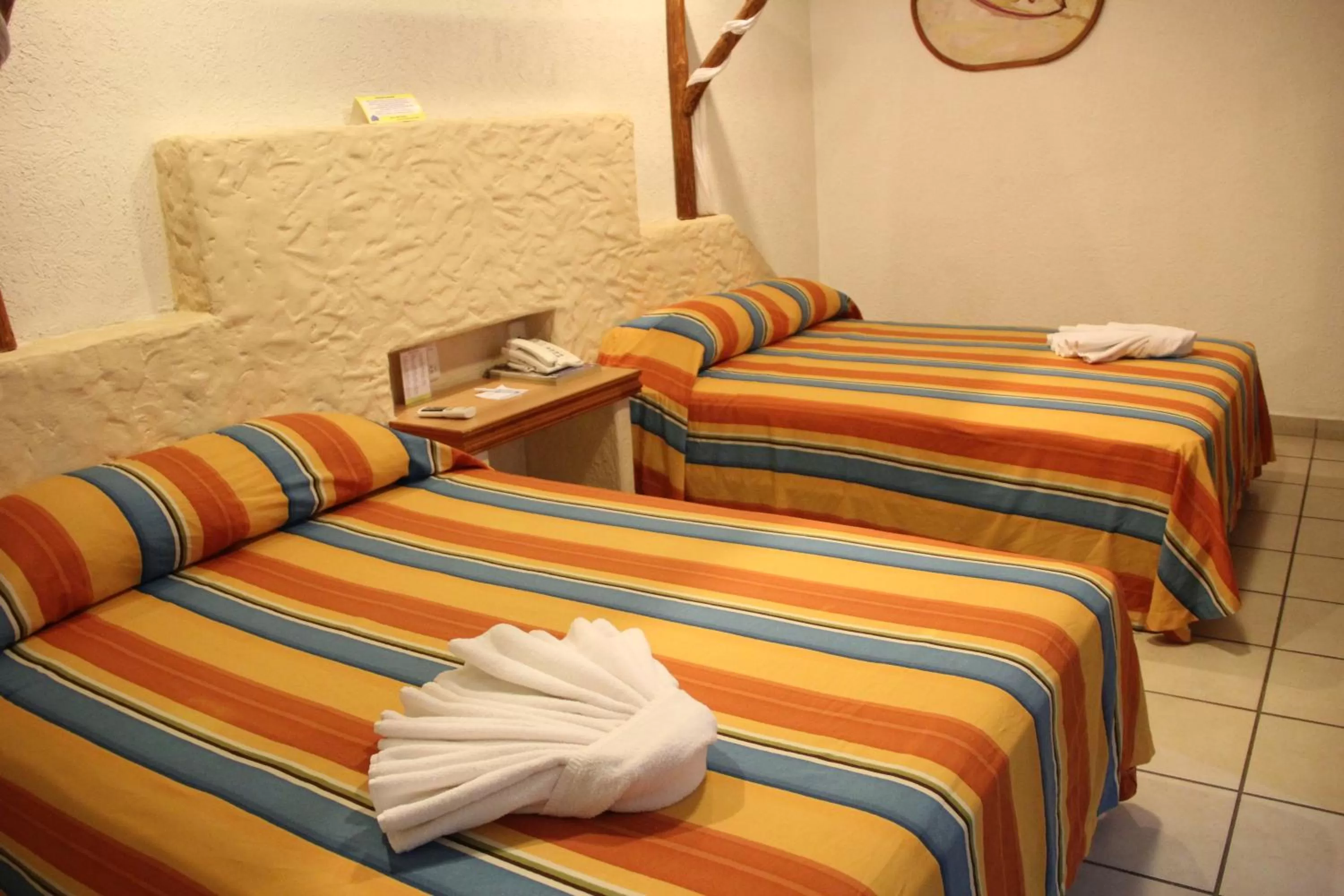 Bed in Hotel Palapa Palace