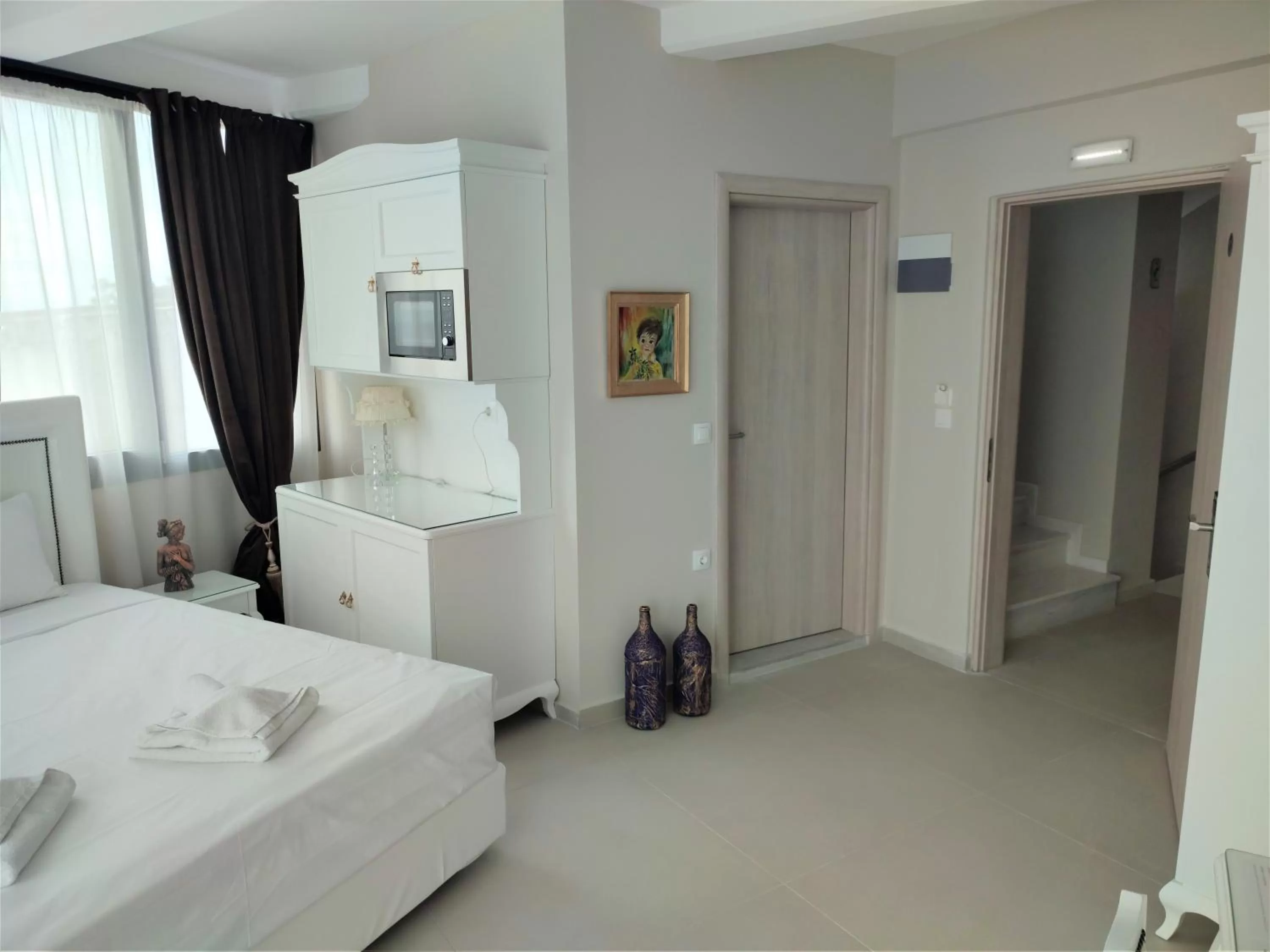 Photo of the whole room, Bed in Light Blue Hotel