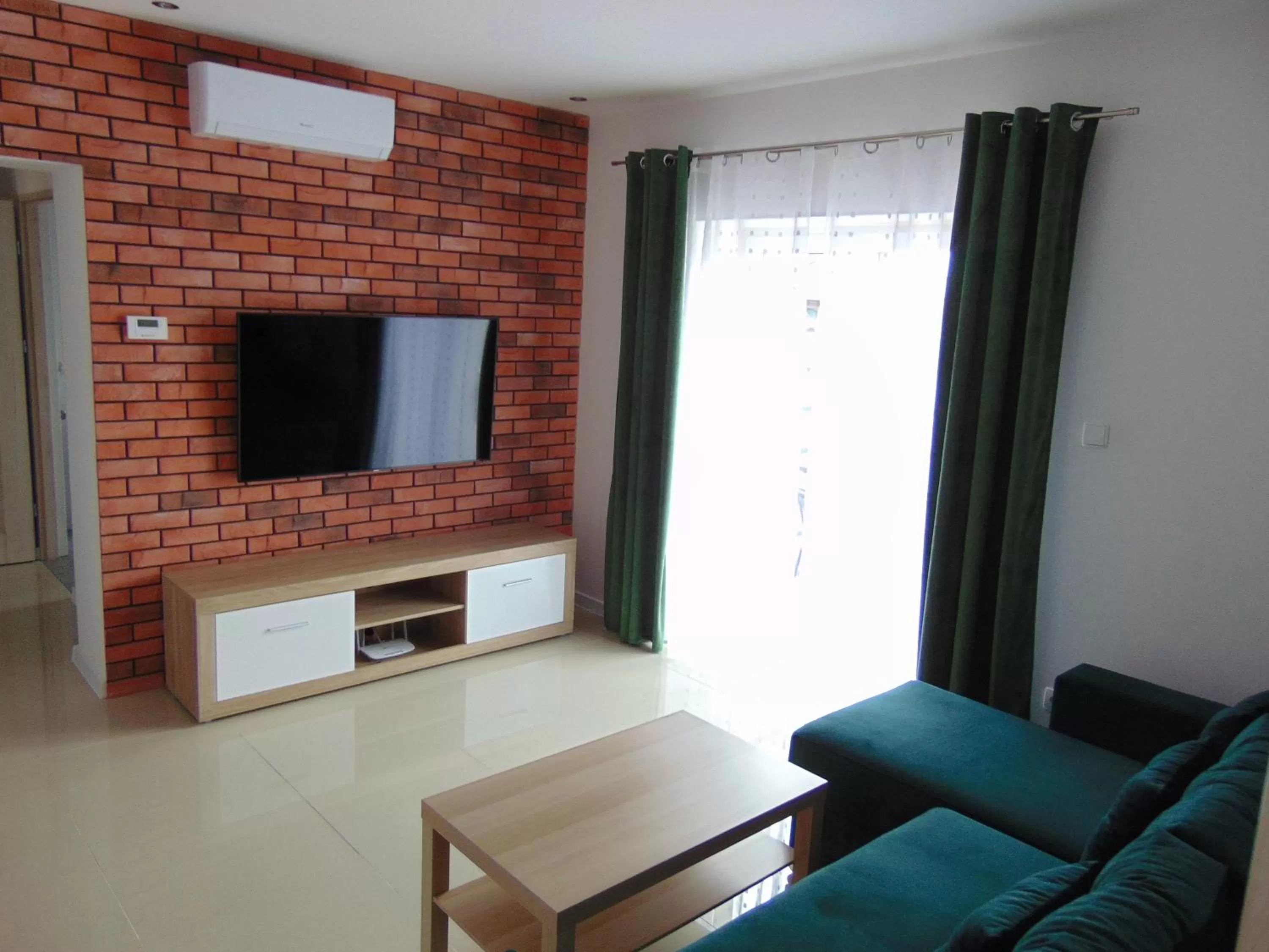 Communal lounge/ TV room in Apartamenty Monik Świętochłowice