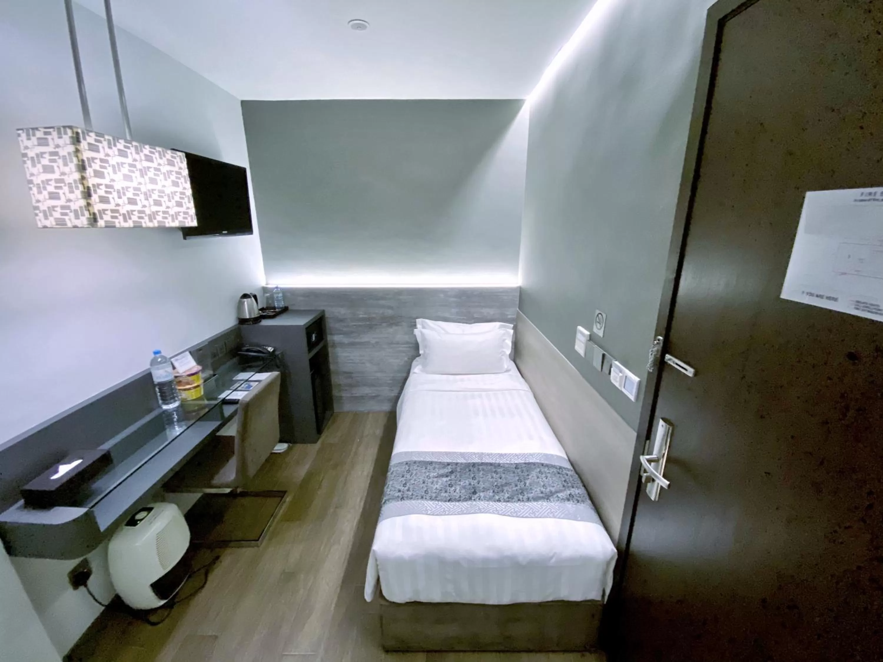 Bed in Bliss Hotel Singapore