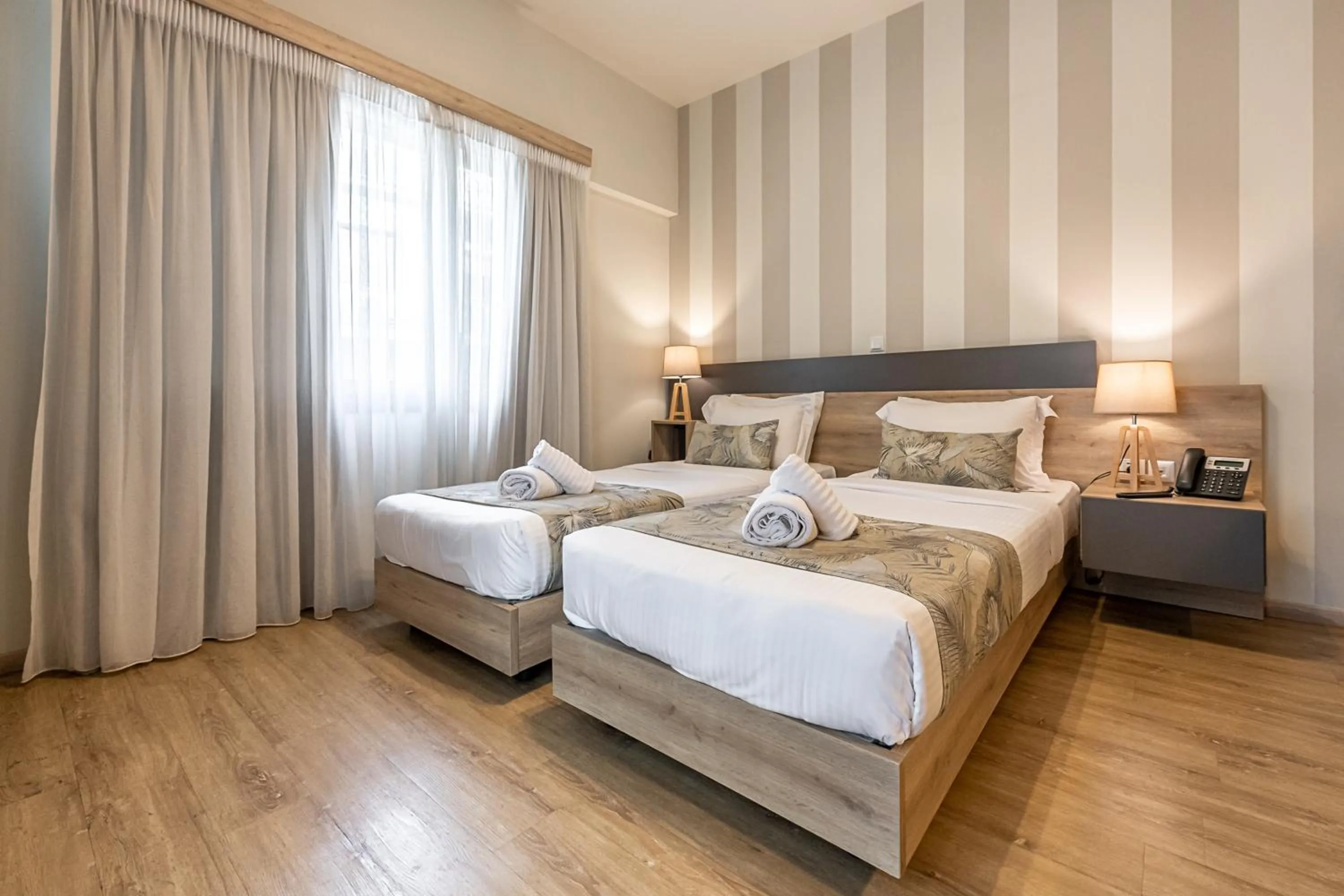 Bed in Hotel @Syngrou Fix