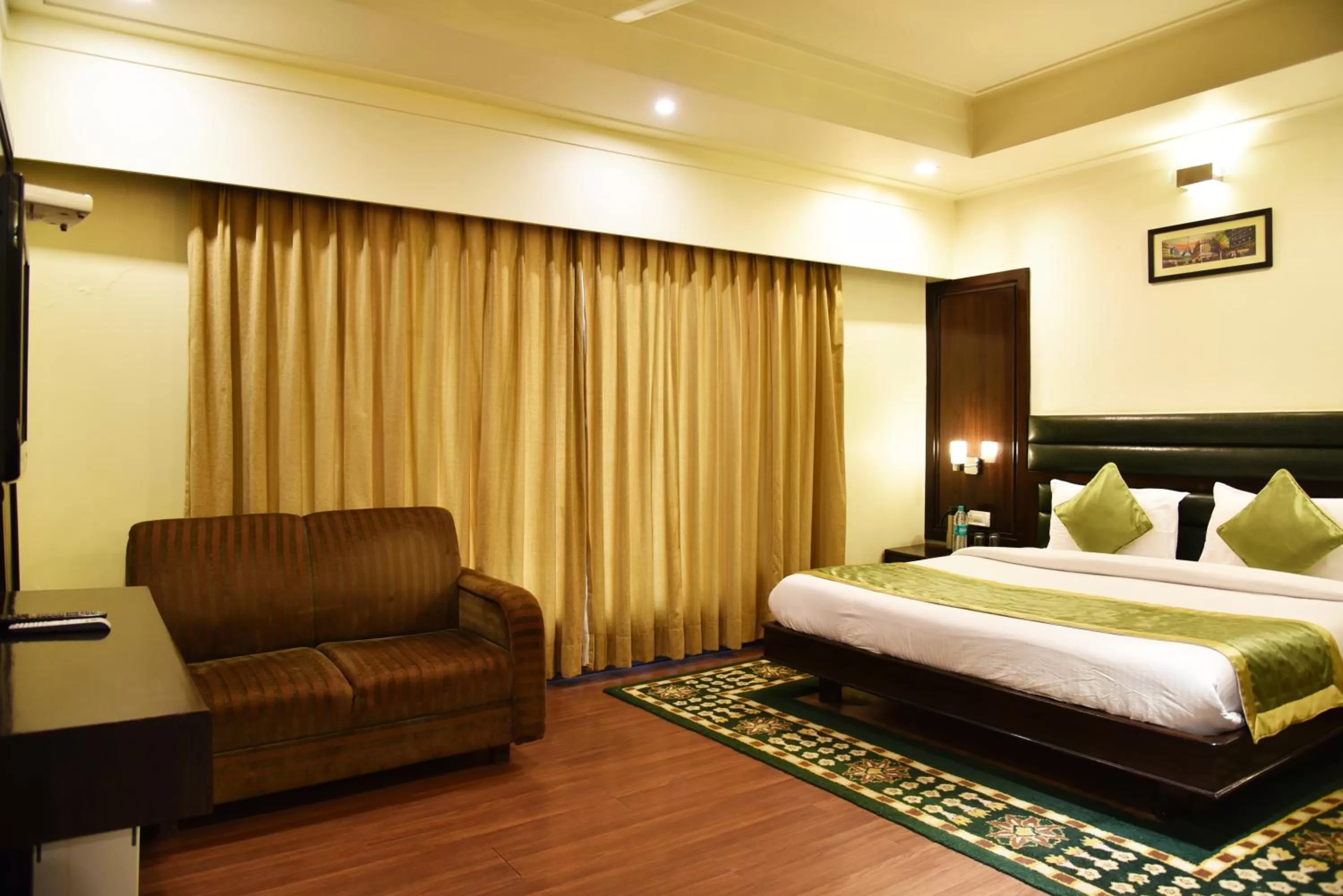 Photo of the whole room, Bed in Indraprastha Resort - Centrally Heated Rooms, with Gym, Games & Spa