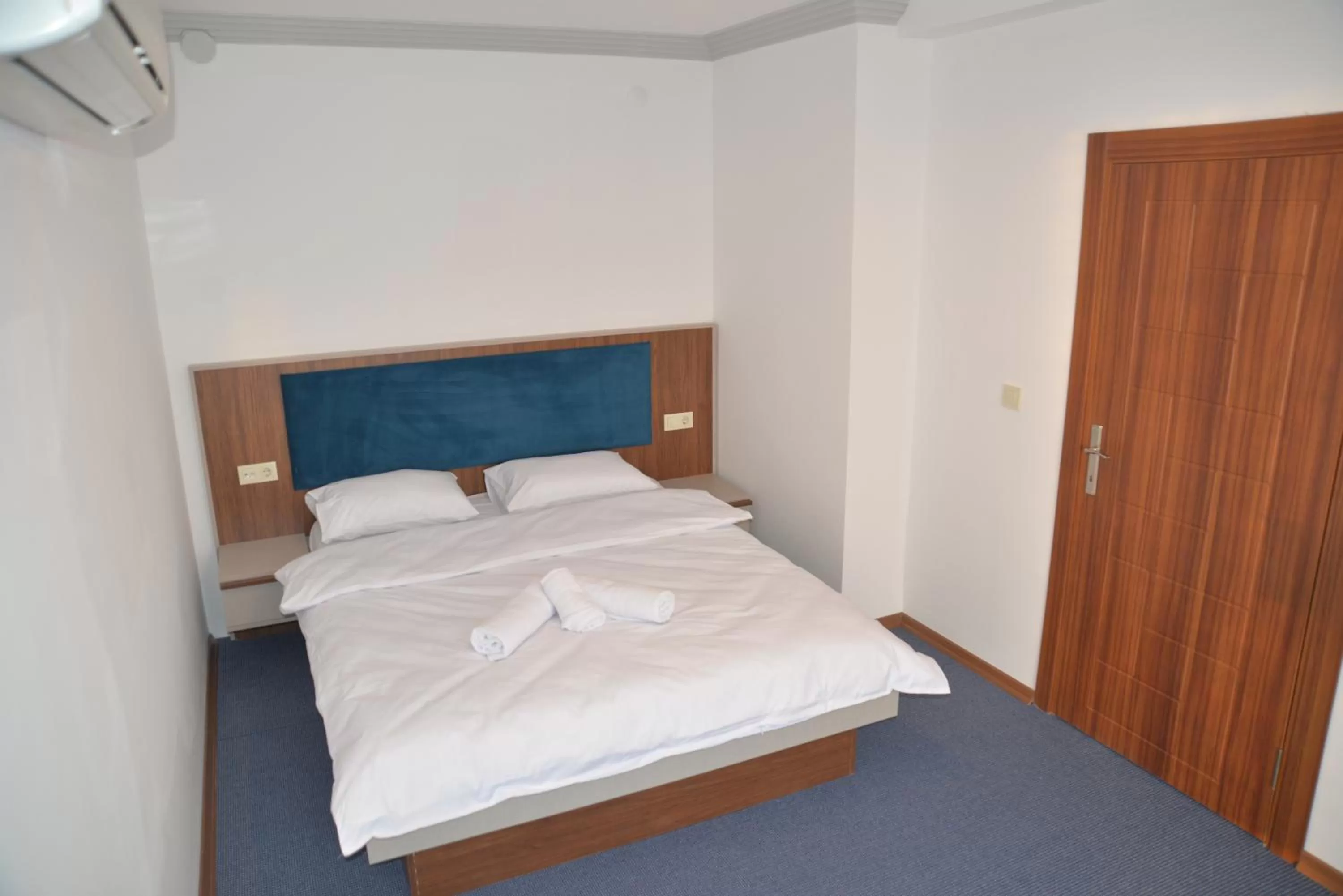 Bed in TEVETOGLU HOTEL