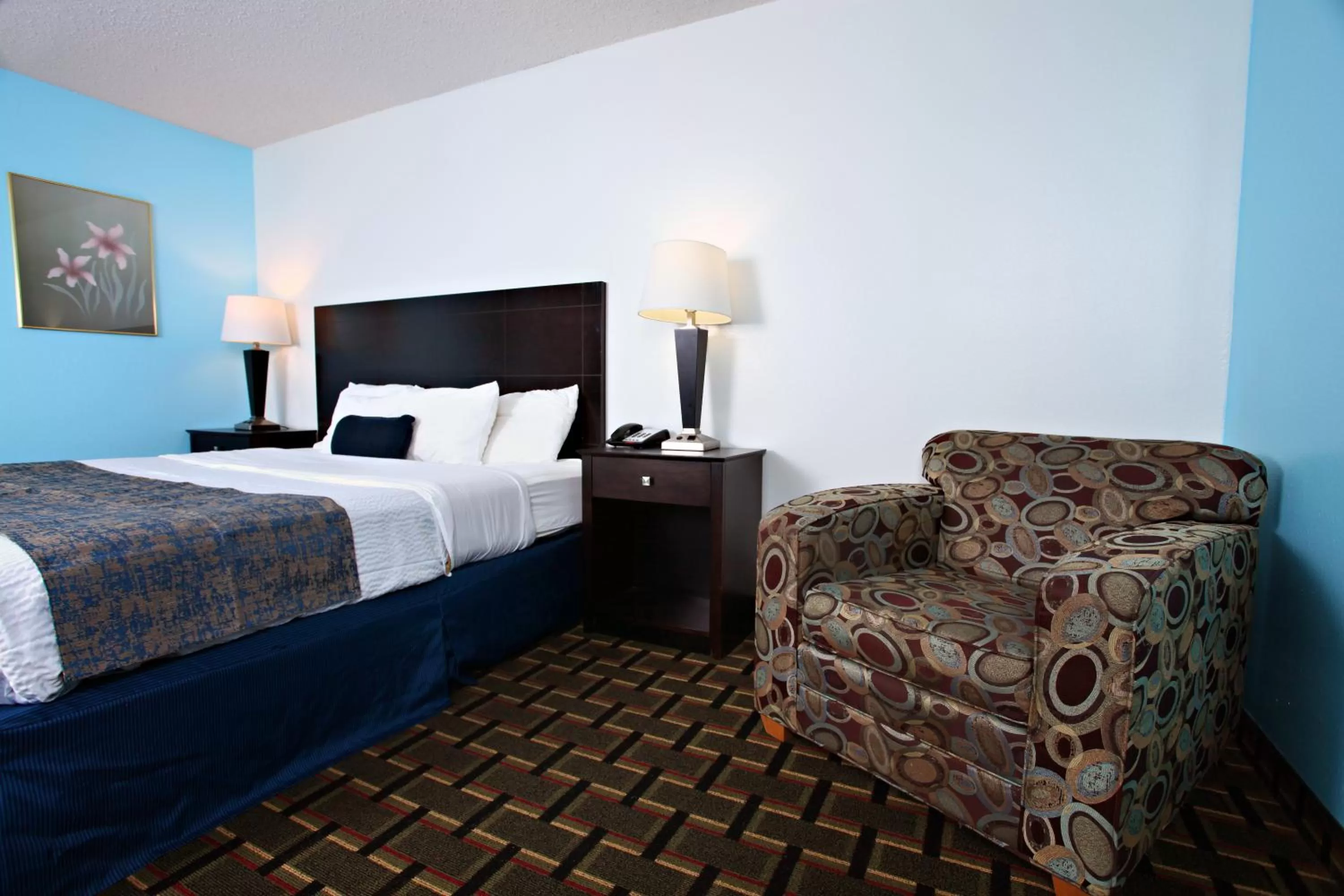 Bed in Coratel Inn & Suites by Jasper Newton