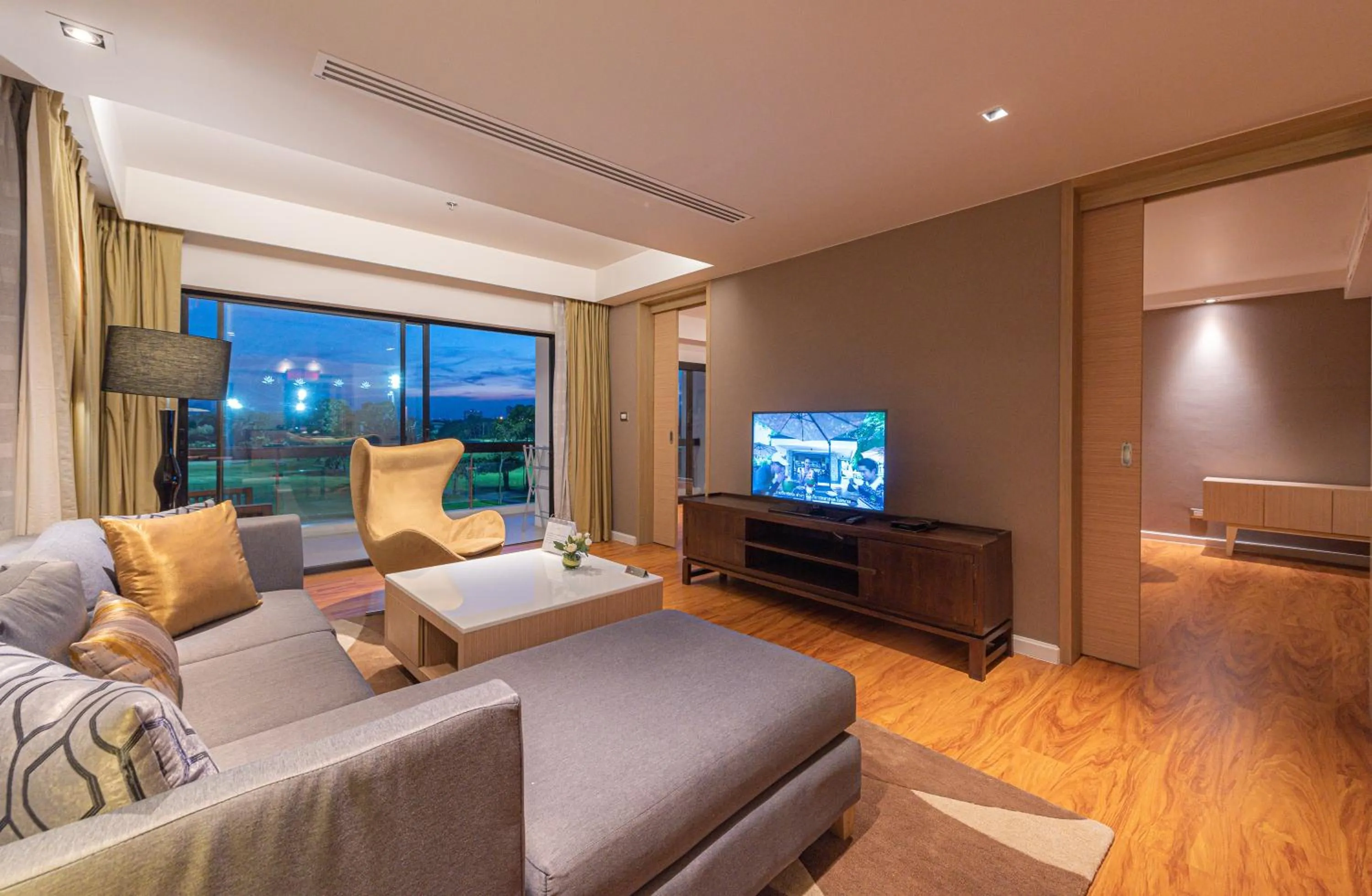 Living room in Summit Windmill Golf Suite Hotel at Suvarnabhumi