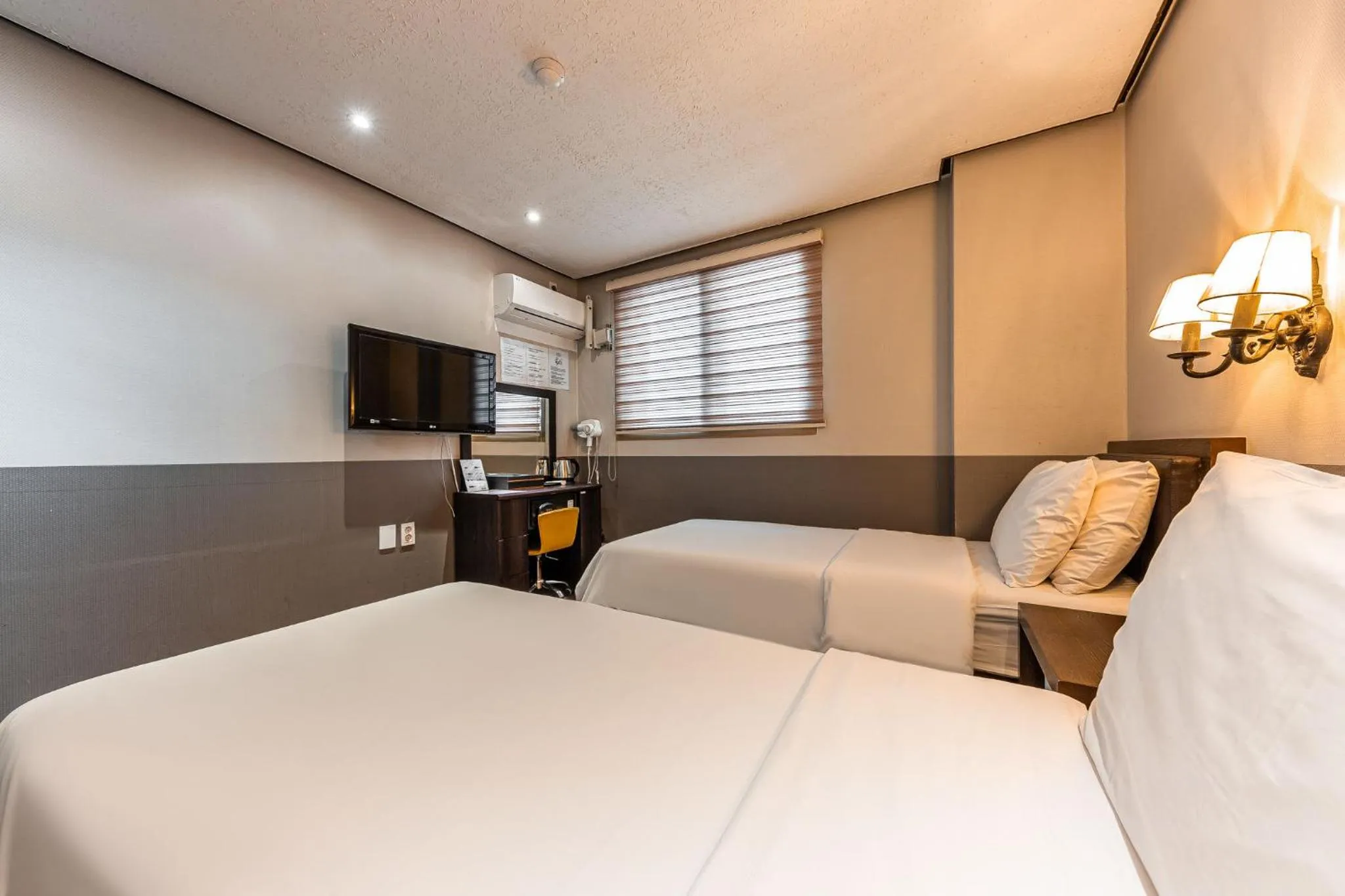 Bed in Friendly DH Naissance Hotel by Mindrum Group