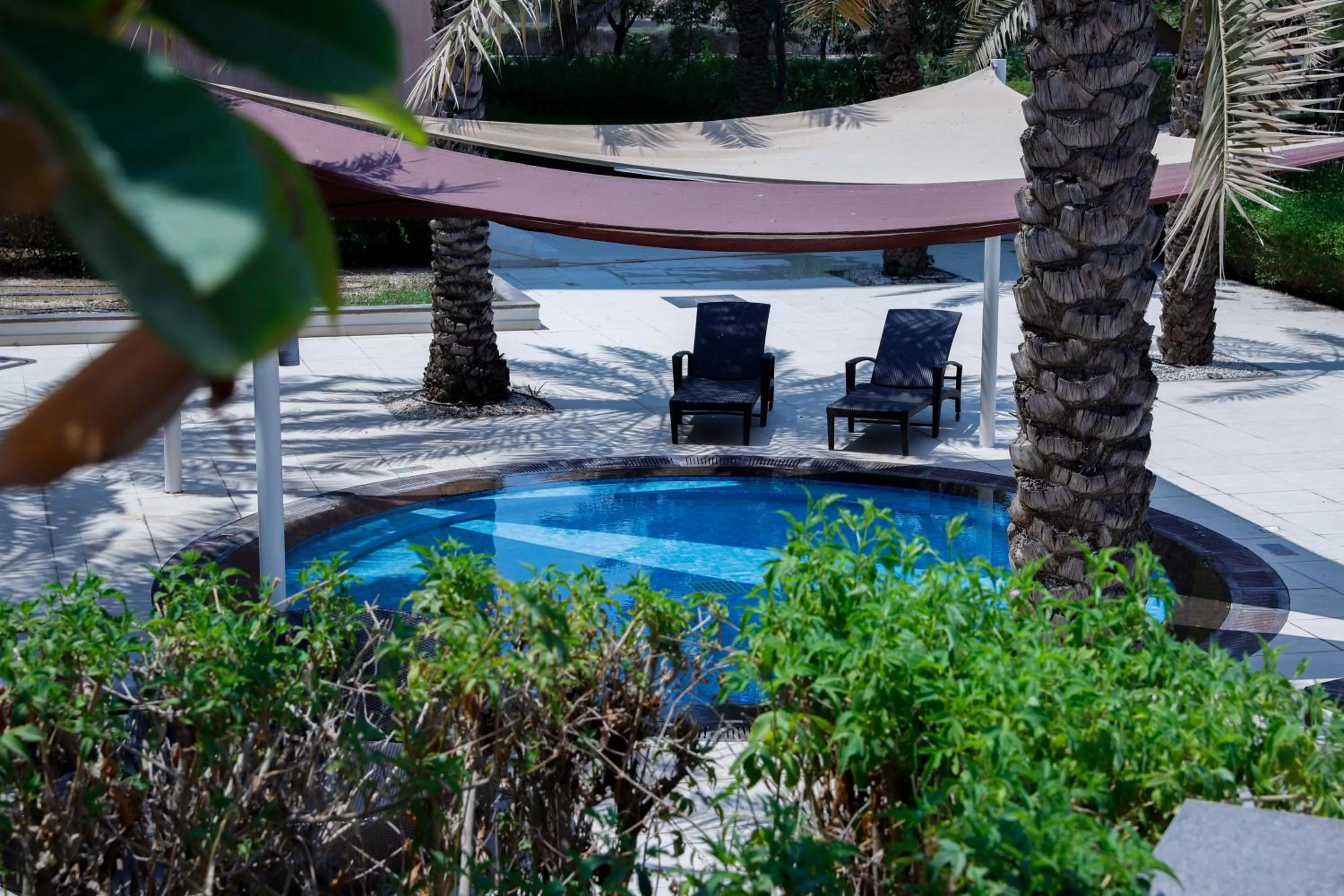 Swimming pool in Crowne Plaza Sohar by IHG