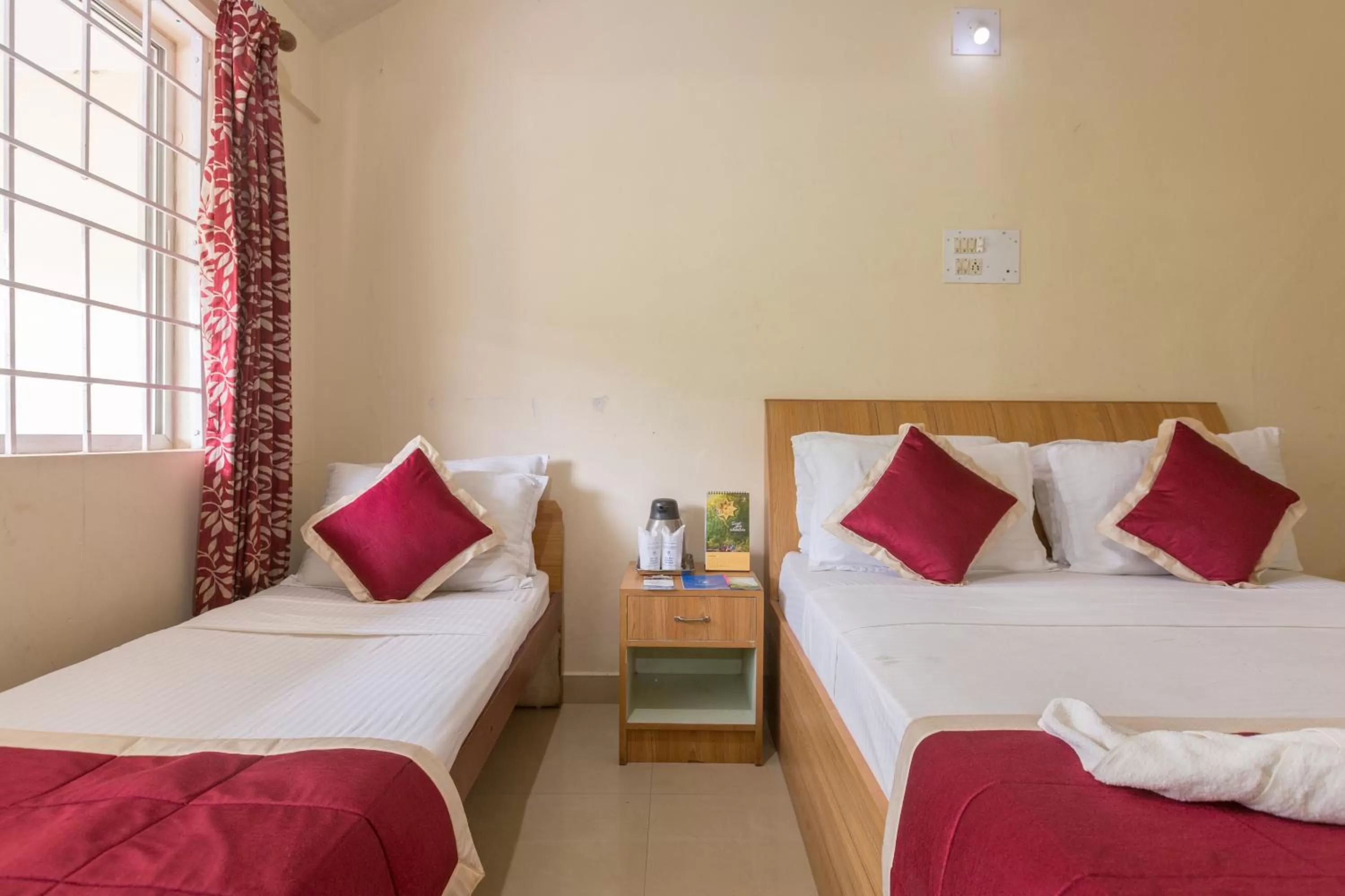 Bed in KSTDC Hotel Mayura TalaKaveri, Bhagamandala