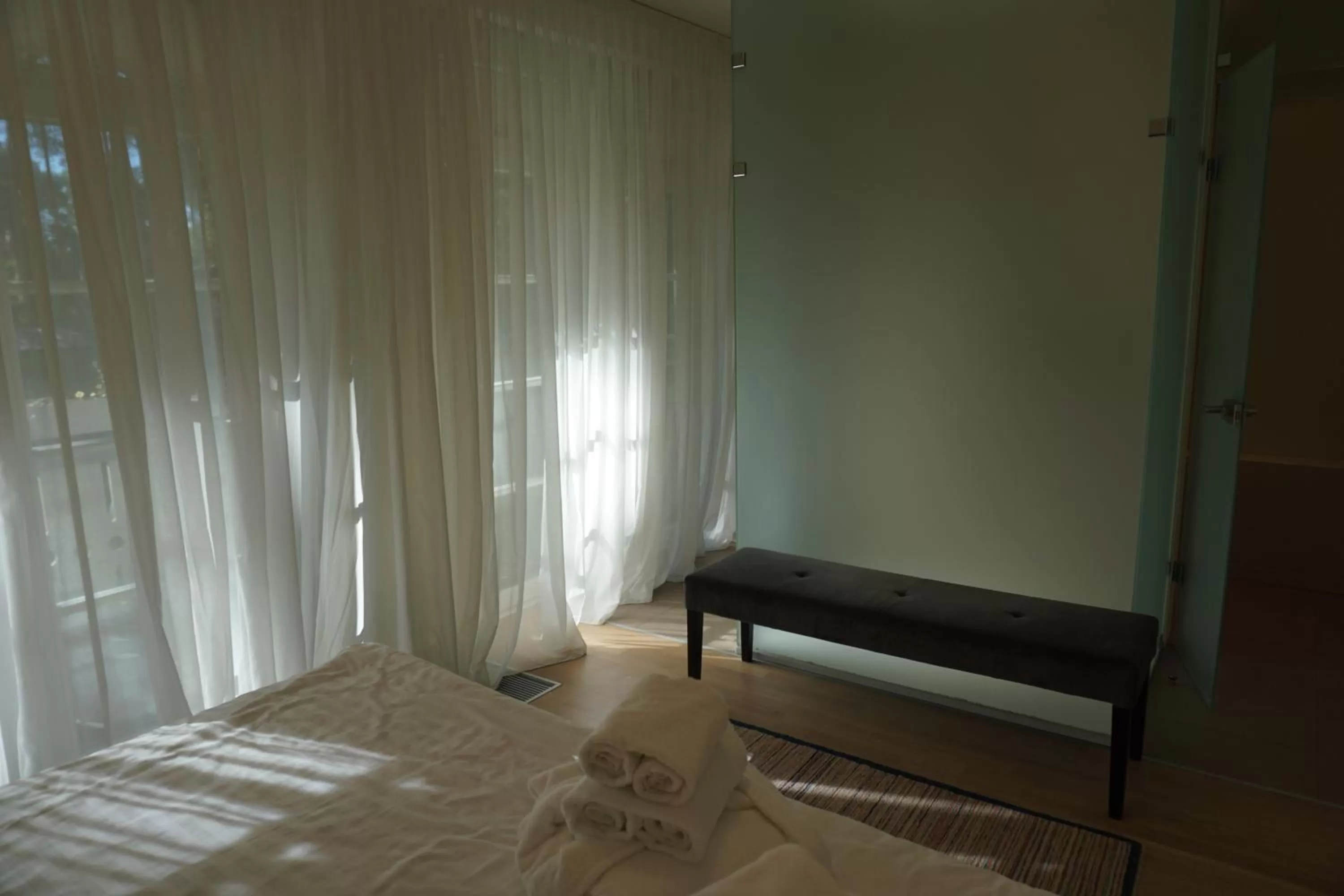 Seating area, Bed in Wooden Villa APARTMENTS
