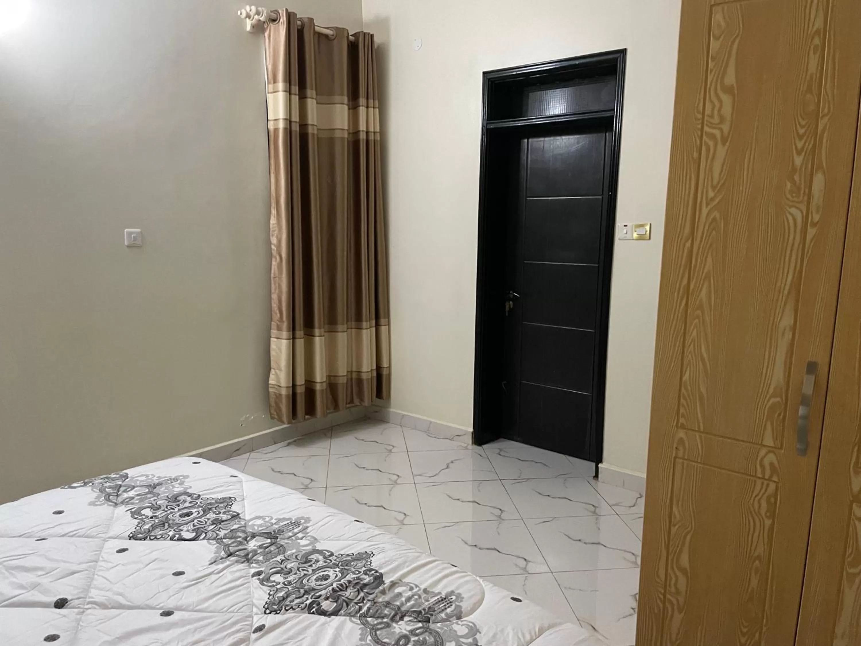 Bedroom, TV/Entertainment Center in Jaffa Suites