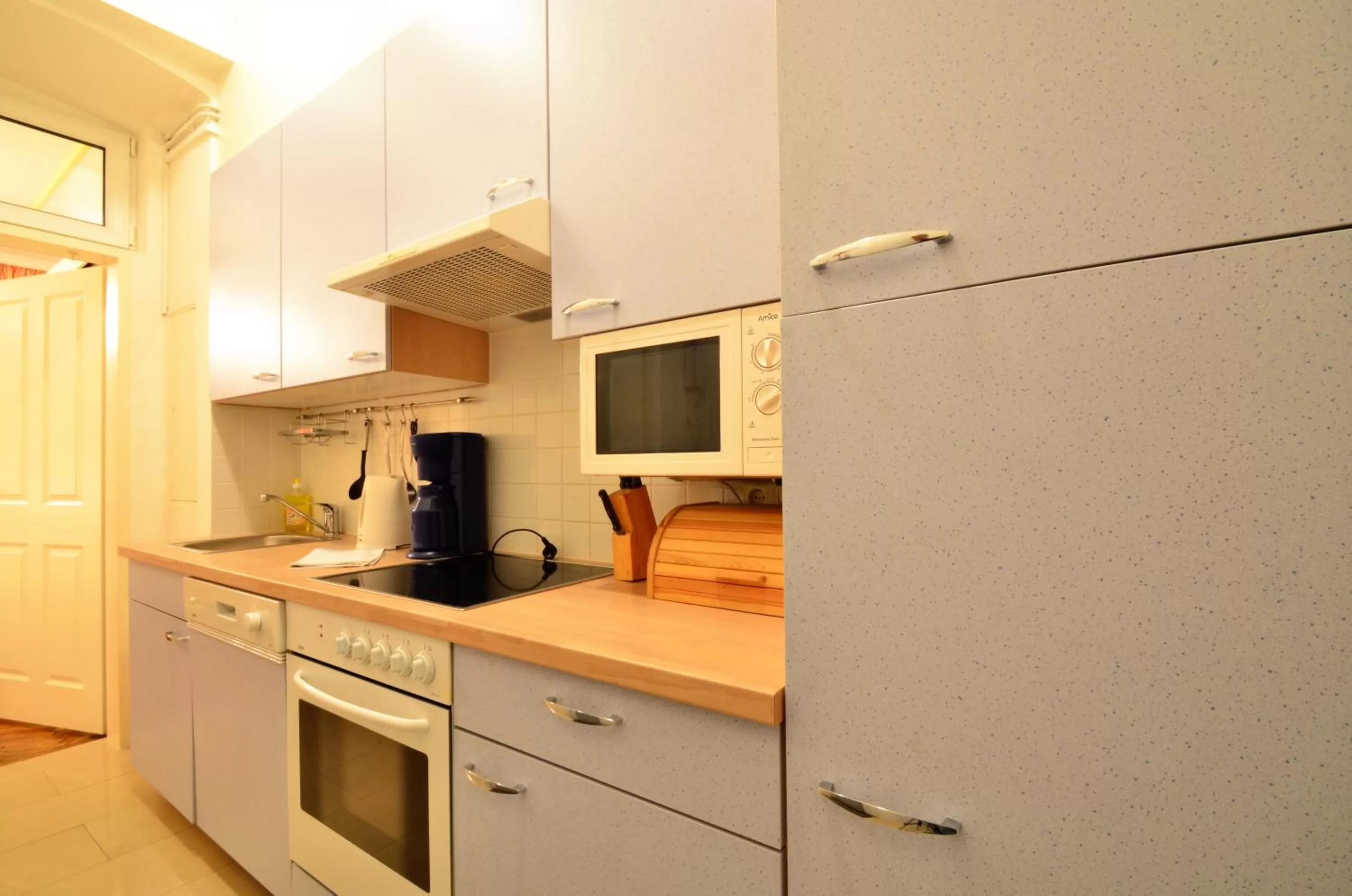 Kitchen or kitchenette in AJO Apartments - Messe City Flat - Self-Check-in