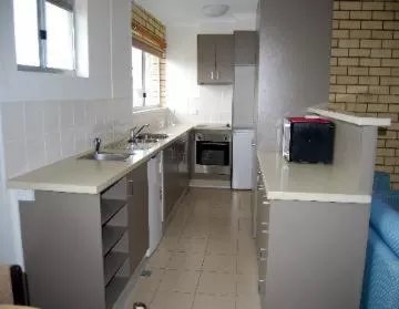 Kitchen or kitchenette in Coastal Comfort Motel