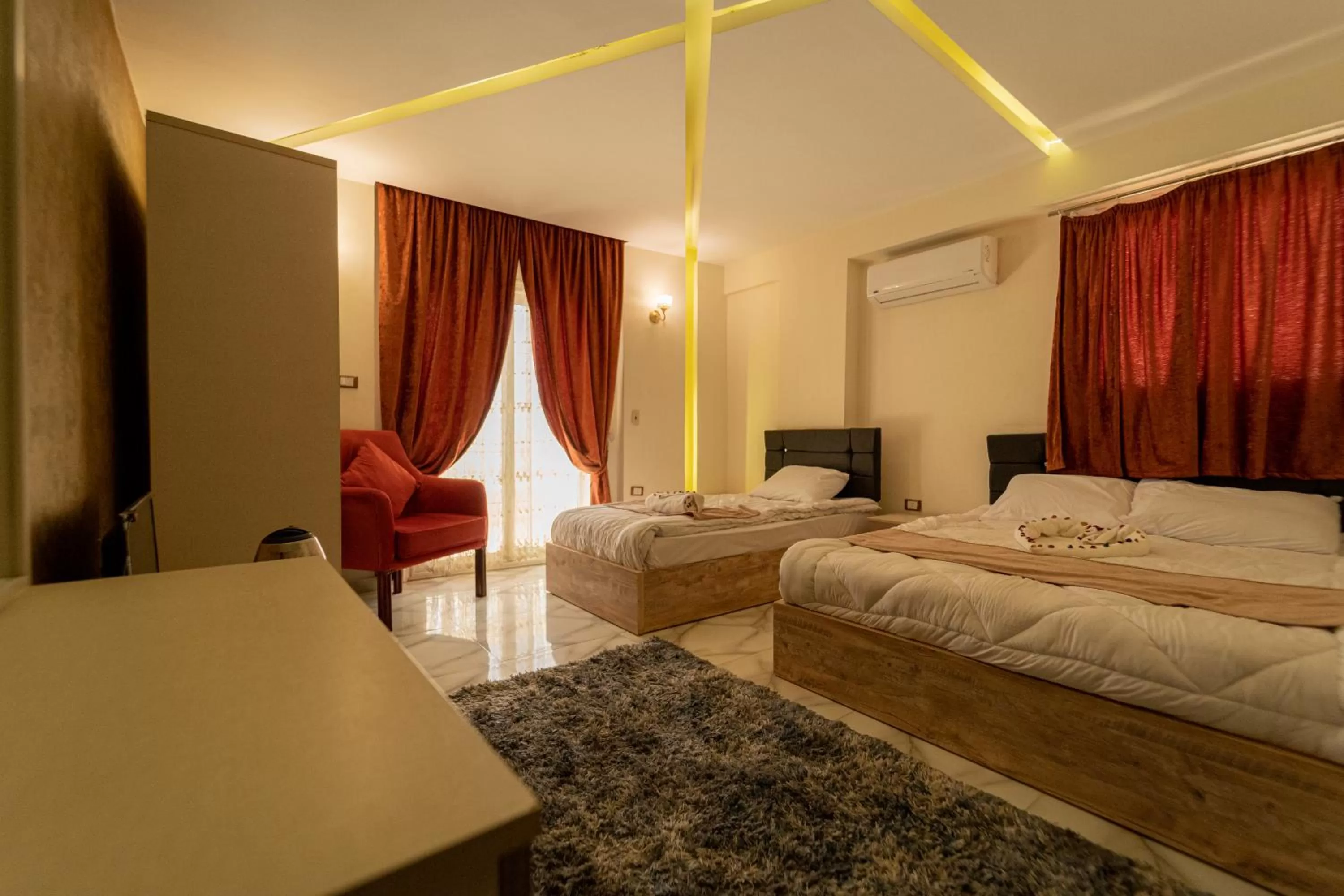 Bed in Gardenia Inn Hotel