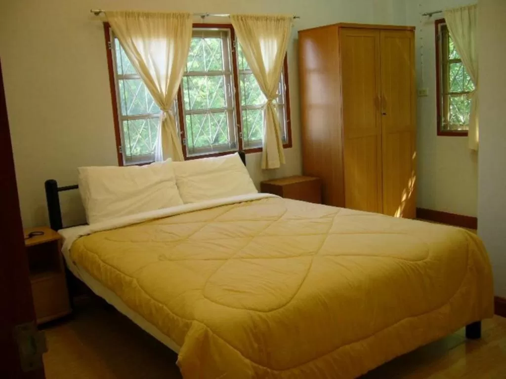 Bed in Pikul Apartment Hotel