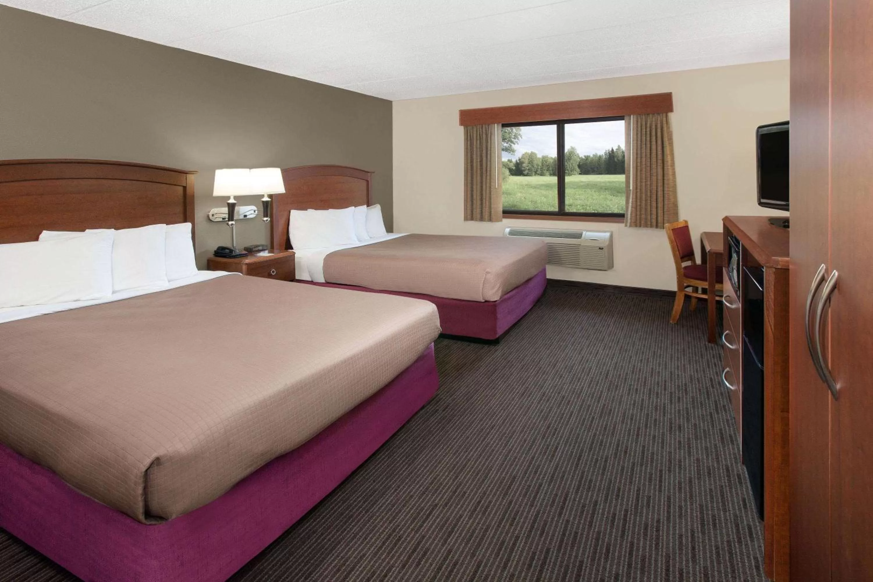 Photo of the whole room, Bed in AmericInn by Wyndham Grundy Center