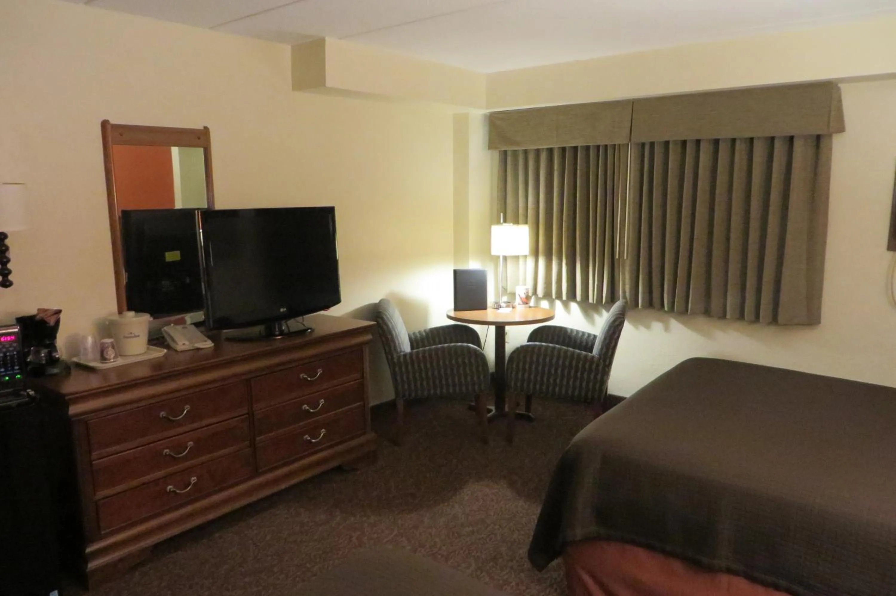 Decorative detail, Bed in AmericInn by Wyndham Forest Lake