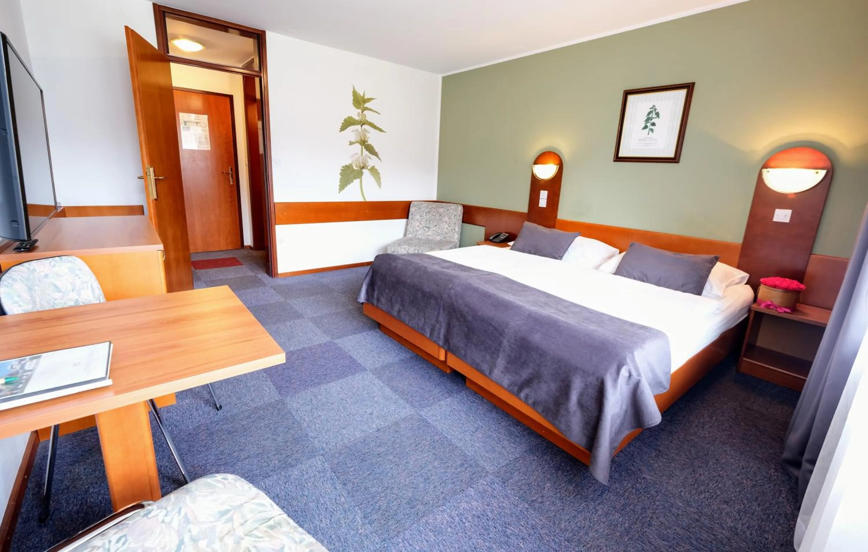 Bed in Hotel Tripič, restaurant and pizzeria