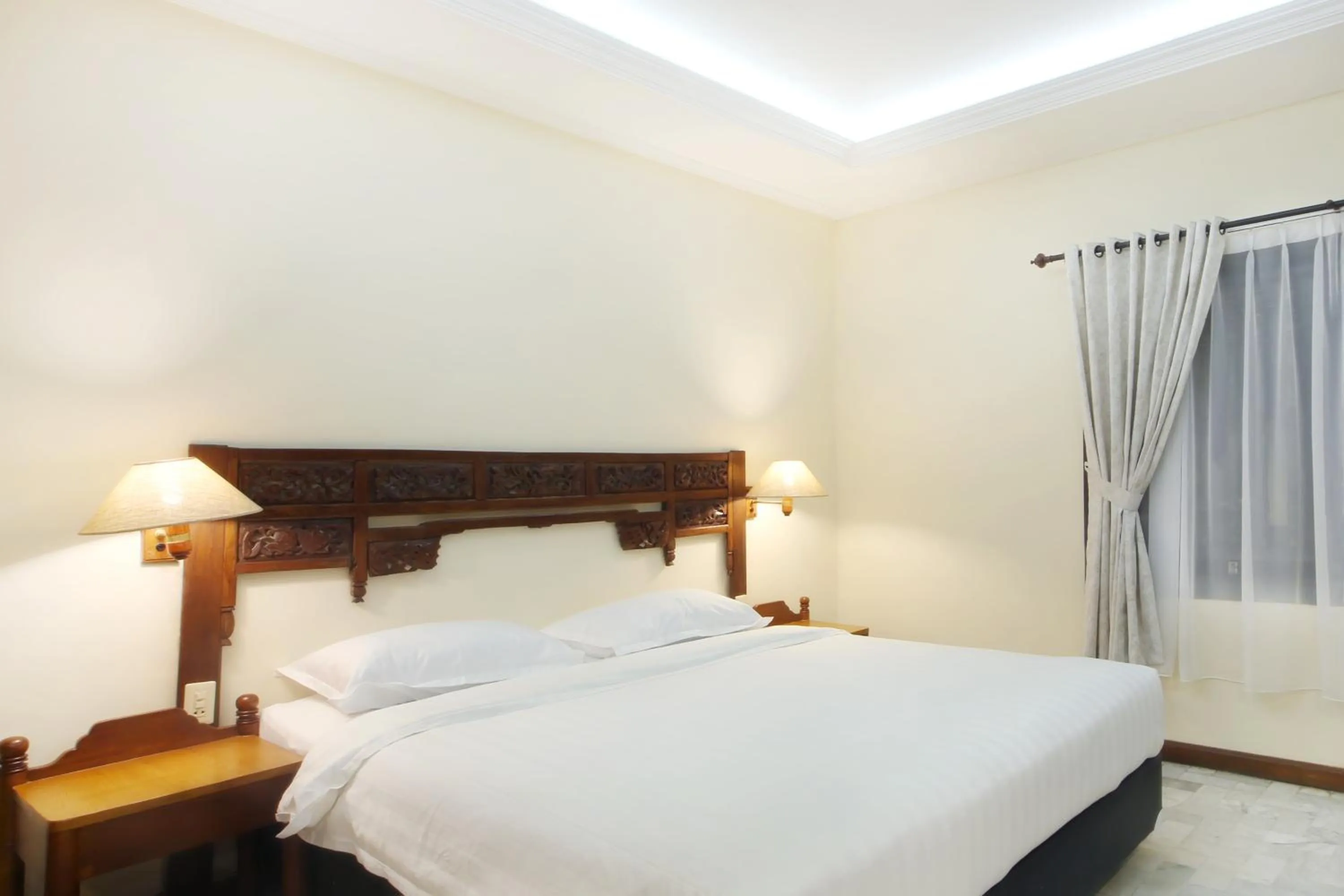 Bed in Bali Bungalo Hotel