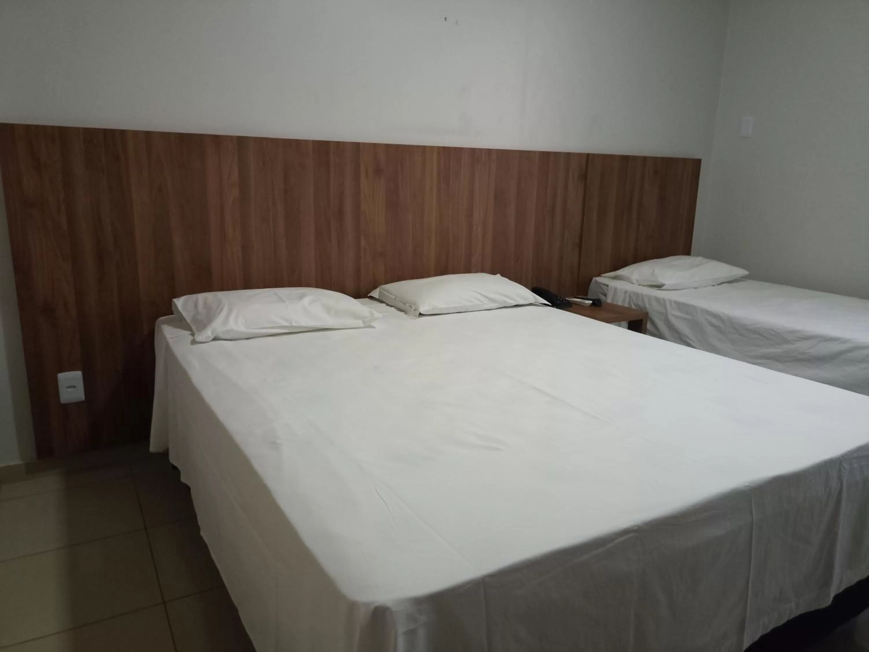 Bed in Hotel Oscar Econômico