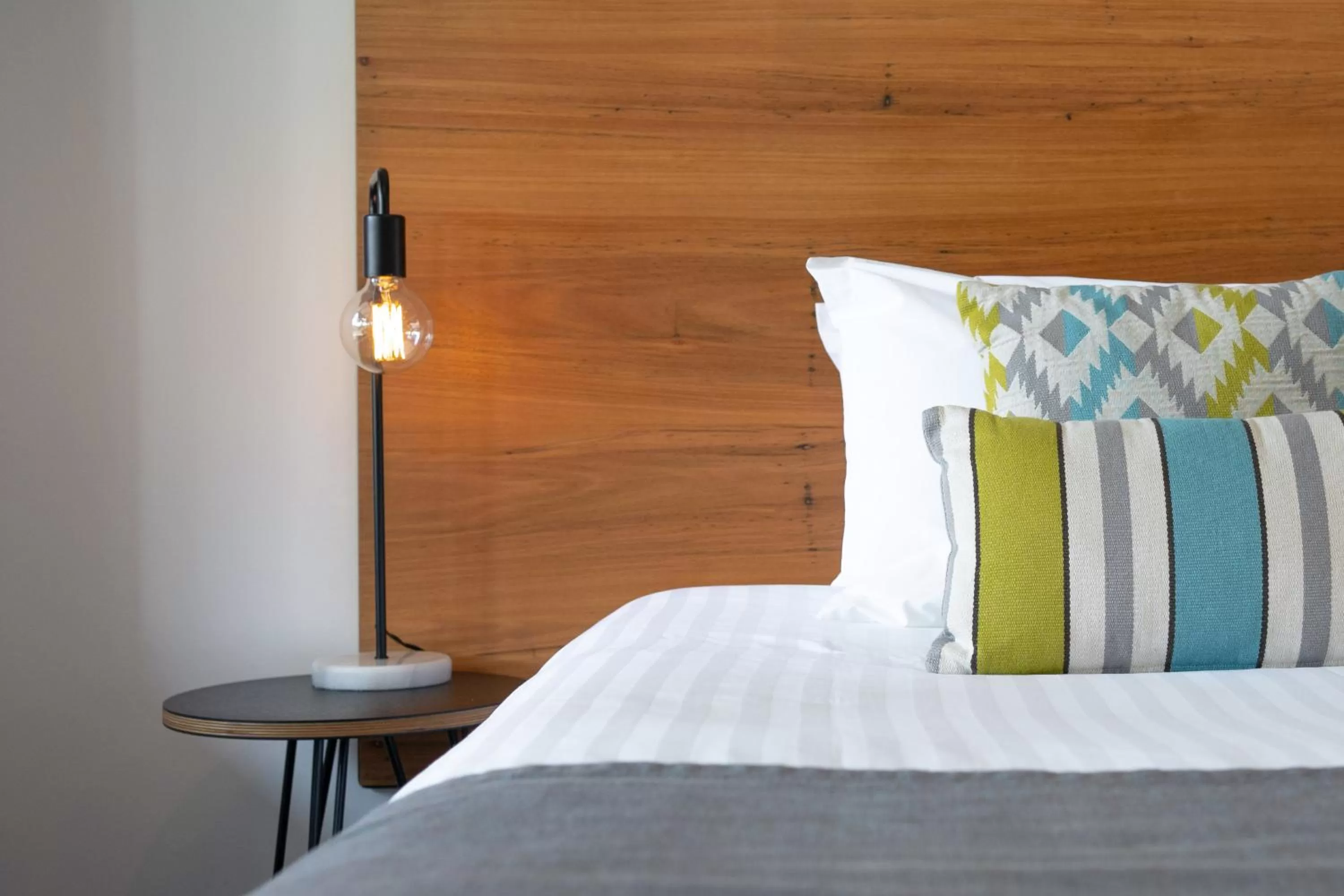 Bed in Bright Colonial Motel