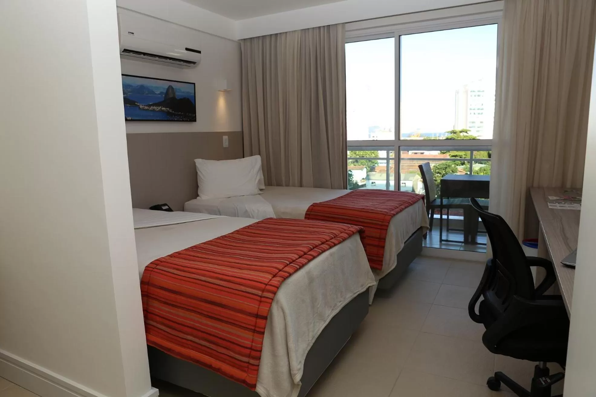 Bed in Ramada by Wyndham Macae Hotel & Suites