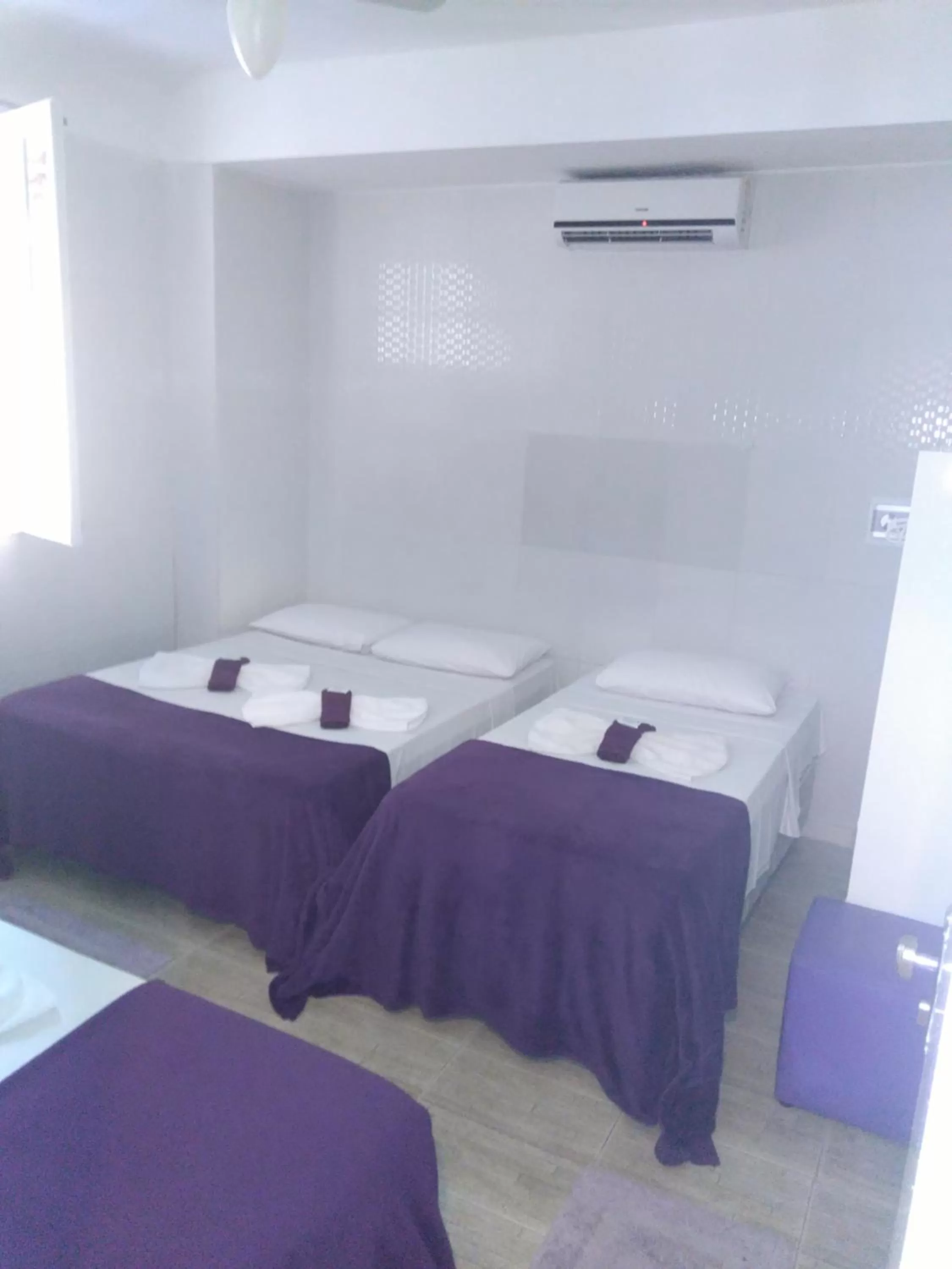 Bed in Hotel Pousada Papaya Verde