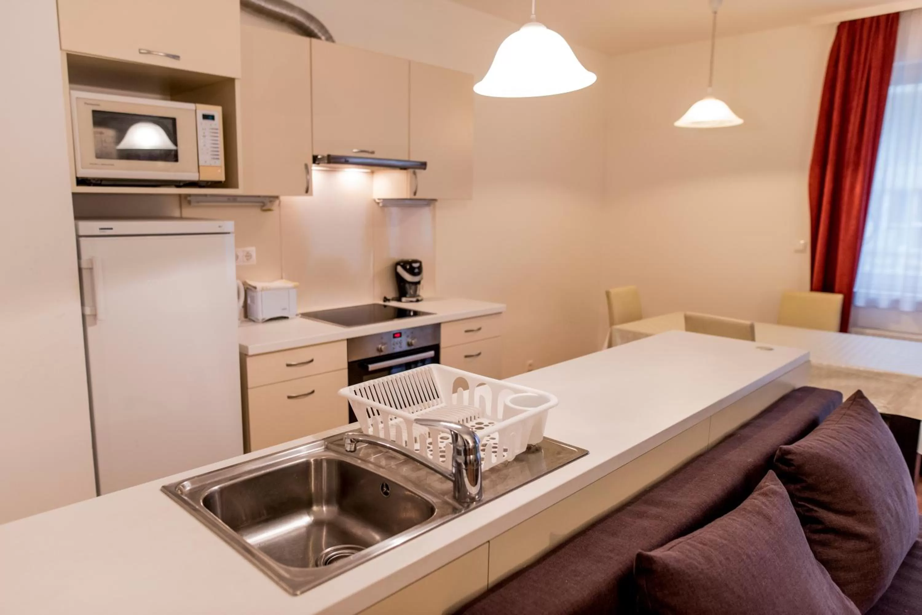 Kitchen or kitchenette in Agape Apartments