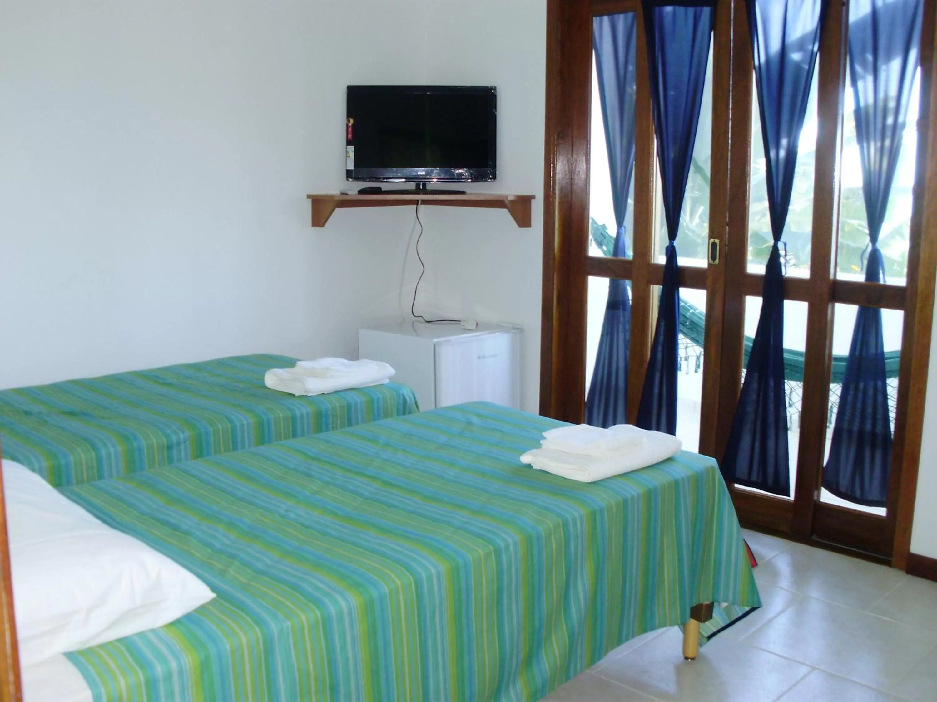 Bed in Pousada Piquara