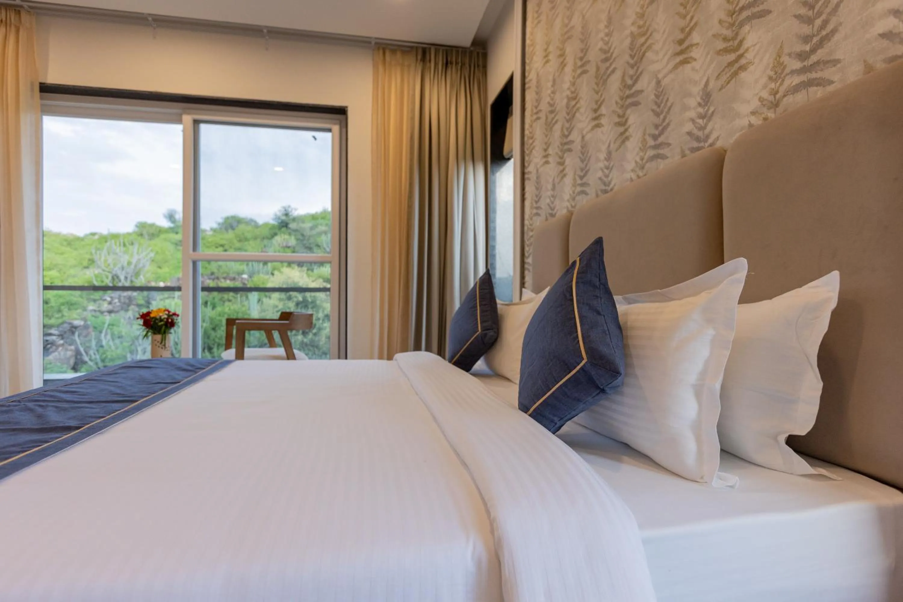 Bed in SURAMYA-A Luxury Boutique Hotel