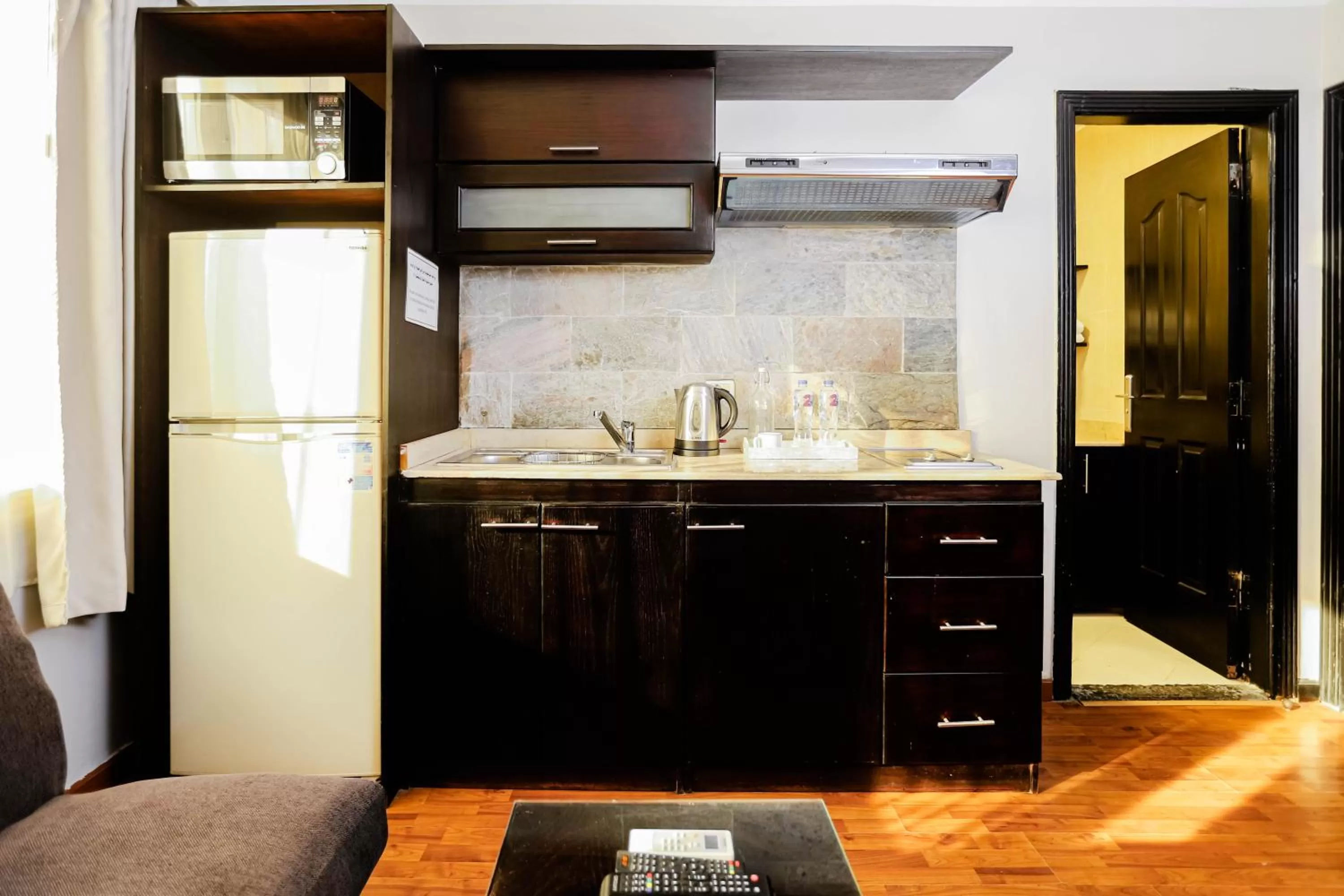 Kitchen or kitchenette in NewCity Hotel & Suites